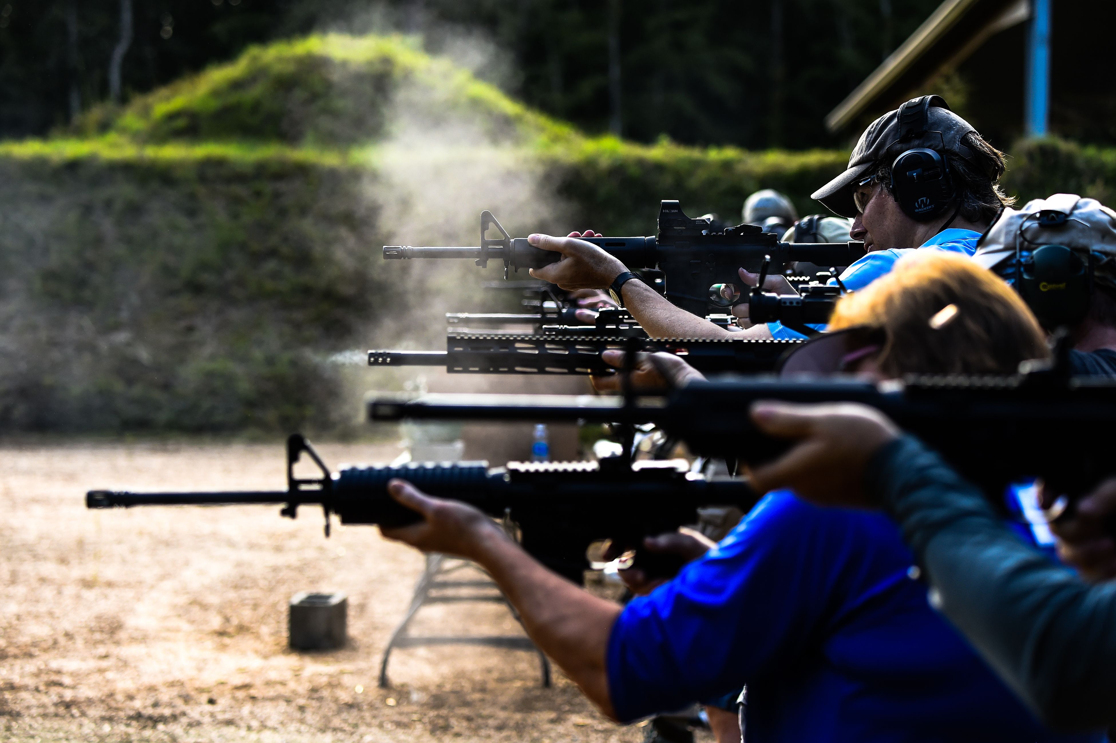 Students fire AR-15 semi-automatic rifles during a shooting course at Boondocks Firearms Academy in Jackson, Mississippi on September 26, 2020. - From the countryside to the cities, Americans are engaged in a frenzy of gun-buying fueled by the pandemic, protests and politics. (Photo by CHANDAN KHANNA / AFP)