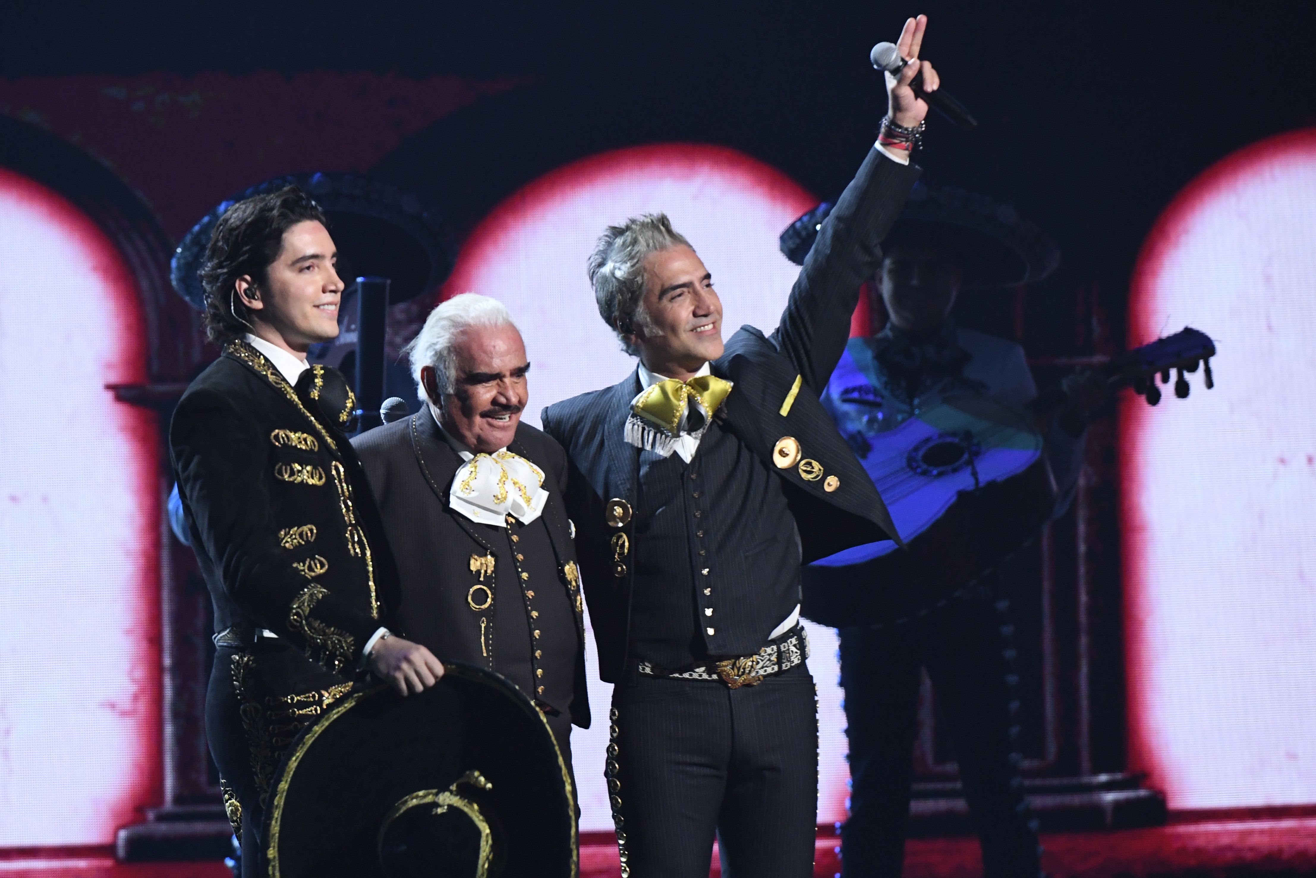 (L-R) Alex Fern�ndez, Vicente Fernandez and Alejandro Fern�ndez perform during the 20th Annual Latin Grammy Awards in Las Vegas, Nevada, on November 14, 2019. (Photo by VALERIE MACON / AFP)