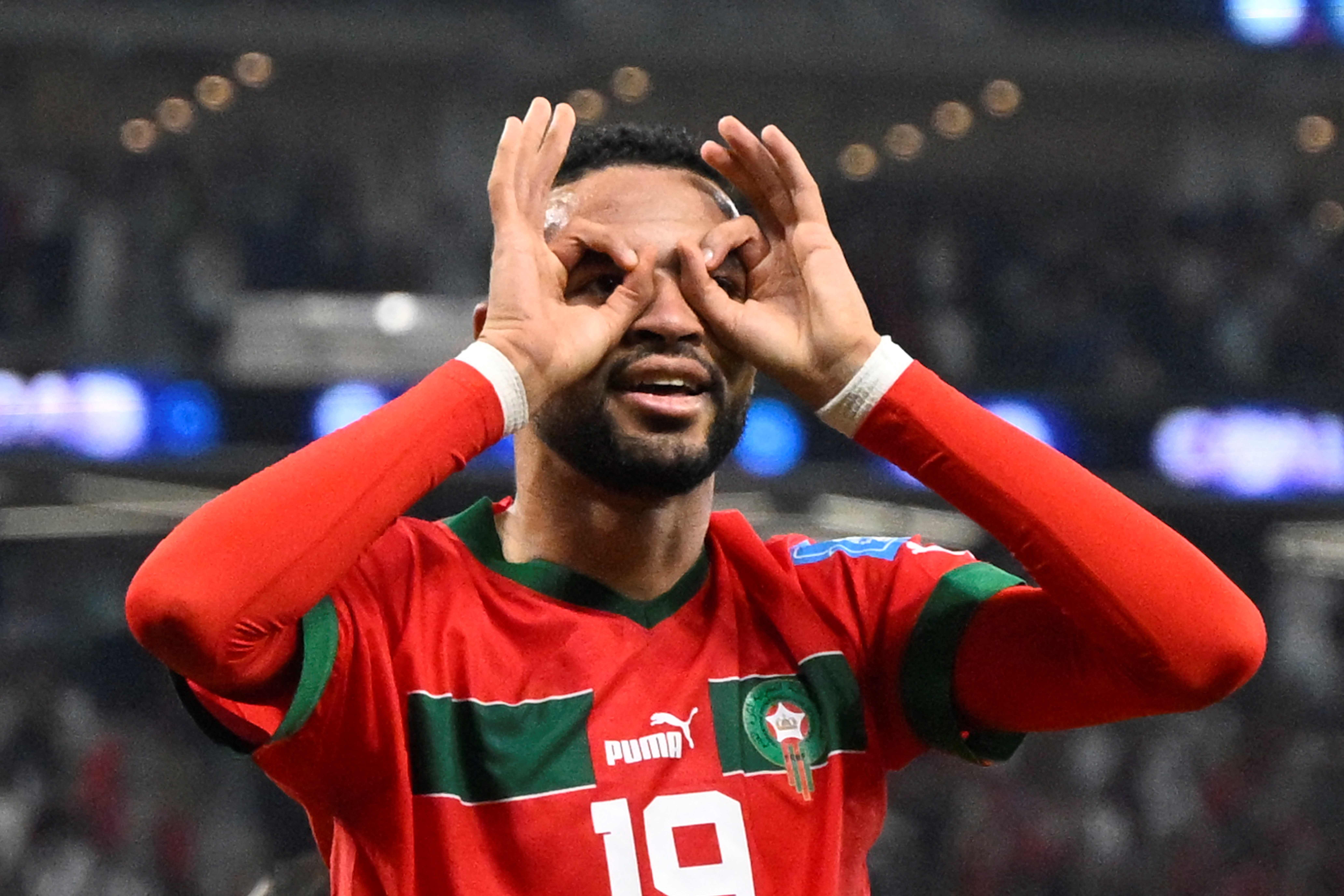 Morocco's forward #19 Youssef En-Nesyri celebrates after scoring the opening goal during the Qatar 2022 World Cup quarter-final football match between Morocco and Portugal at the Al-Thumama Stadium in Doha on December 10, 2022. (Photo by PATRICIA DE MELO MOREIRA / AFP)