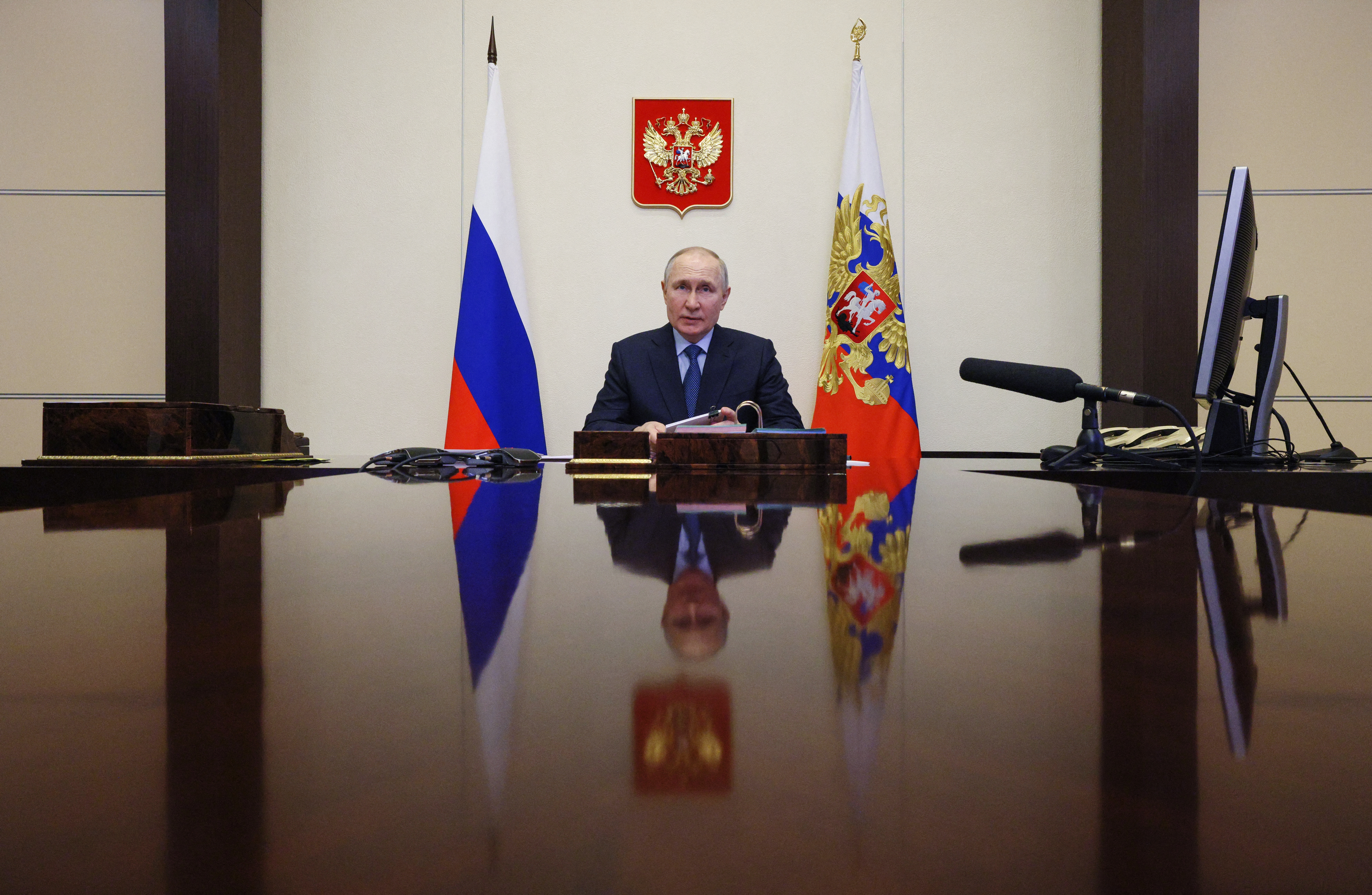 Russian President Vladimir Putin chairs a meeting on the economic issues via a video link at the Novo-Ogaryovo state residence outside Moscow on April 11, 2023. (Photo by Gavriil GRIGOROV / Sputnik / AFP)