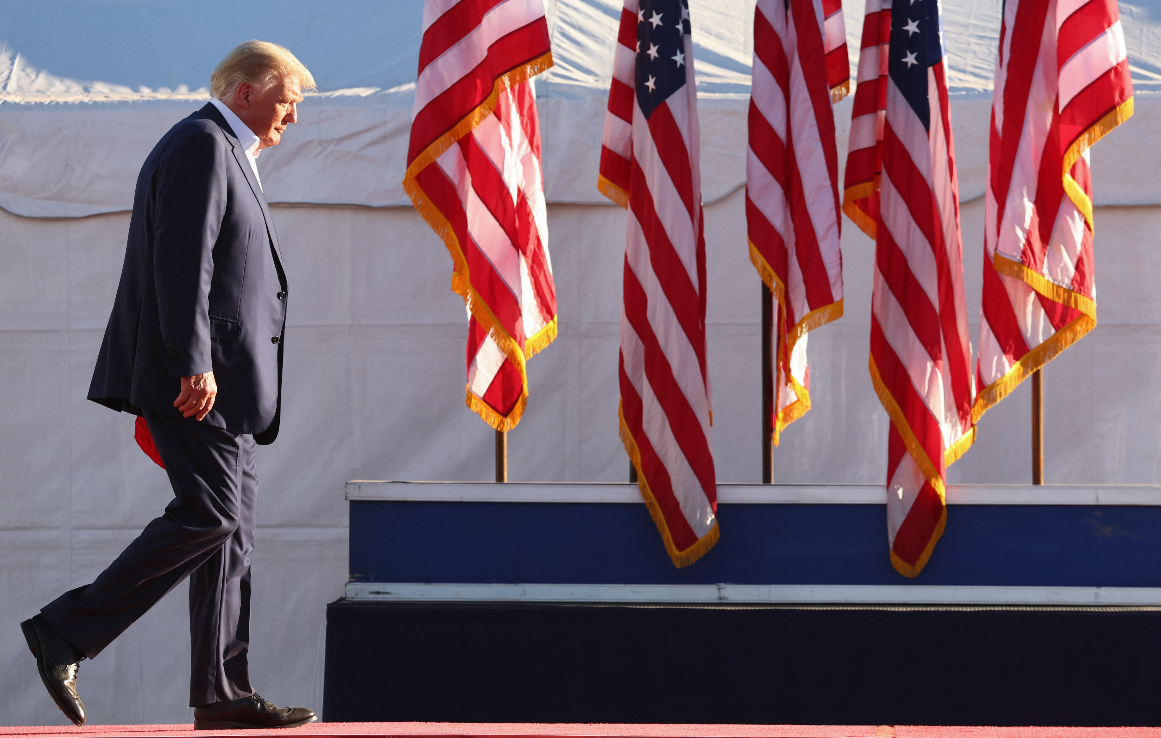 MESA, ARIZONA - OCTOBER 09: Former U.S. President Donald Trump walks to the podium for a campaign rally at Legacy Sports USA on October 09, 2022 in Mesa, Arizona. Trump was stumping for Arizona GOP candidates, including gubernatorial nominee Kari Lake, ahead of the midterm election on November 8. Mario Tama/Getty Images/AFP (Photo by MARIO TAMA / GETTY IMAGES NORTH AMERICA / Getty Images via AFP)