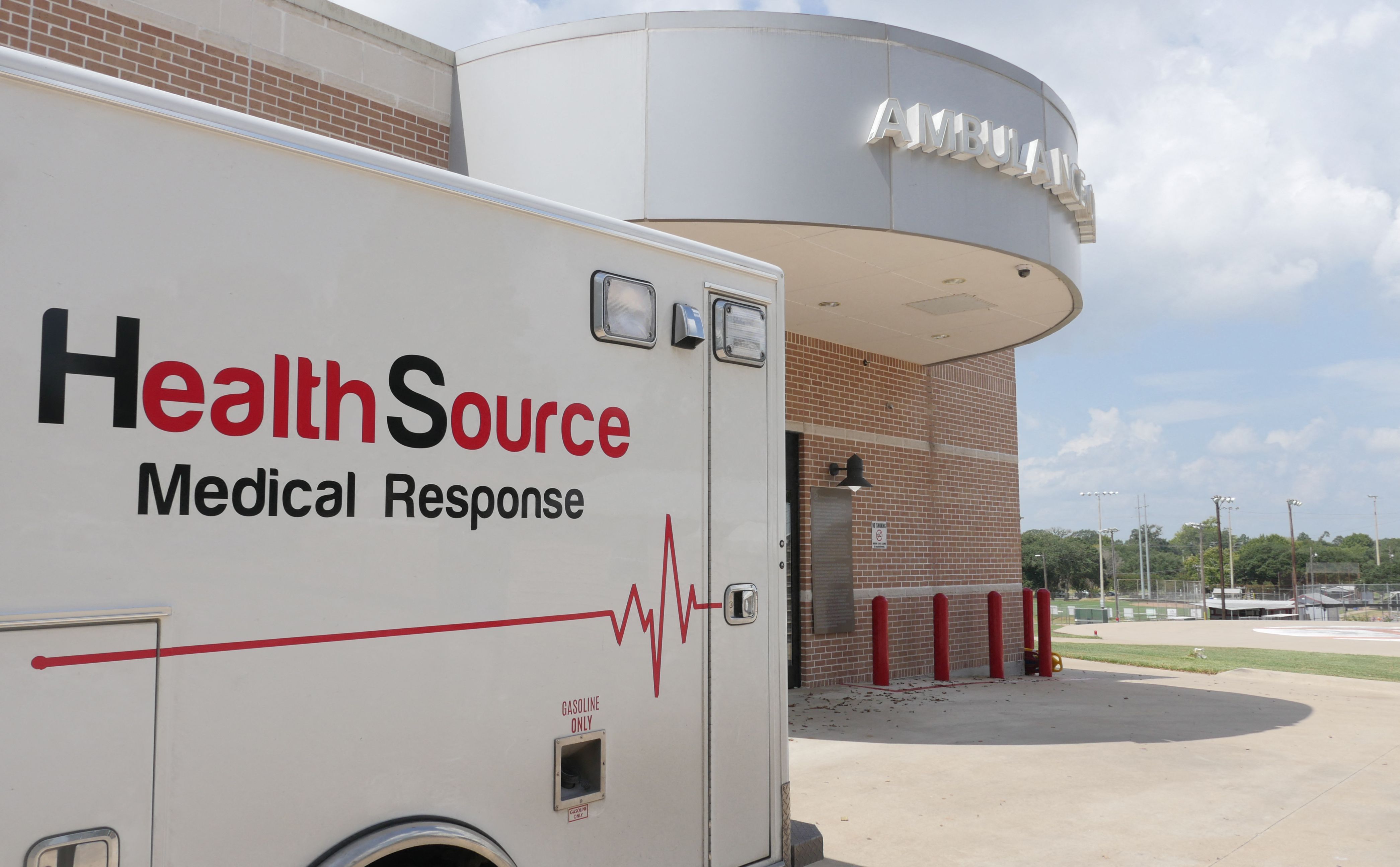 An ambulance is parked outside the Bellville Medical Center after dropping off a patient, in Bellville, Texas, September 1, 2021. - Hospitals in Texas are overwhelmed due to record numbers of Covid-19 hospitalizations. In rural areas, the most seriously ill patients are stuck in facilities that are not equipped to handle them. Every day, one of them dies because they cannot find a place in a facility better suited to their needs. (Photo by Francois PICARD / AFP)