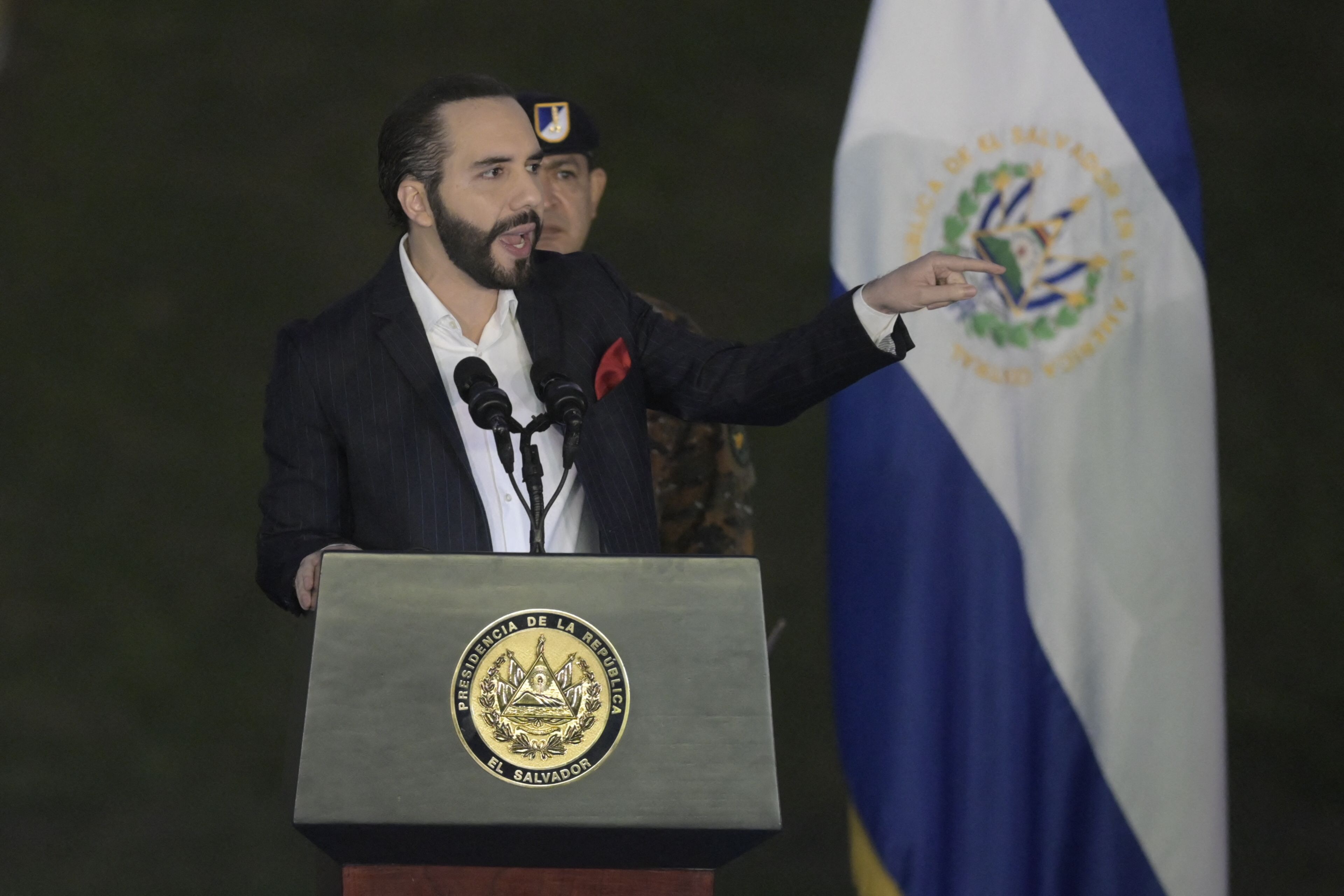 Salvadoran President Nayib Bukele delivers a speech during the graduation of new military personnel, at the Captain General Gerardo Barrios Military School, in Old Cuscatlan, El Salvador, on April 4, 2022. (Photo by Marvin RECINOS / AFP)