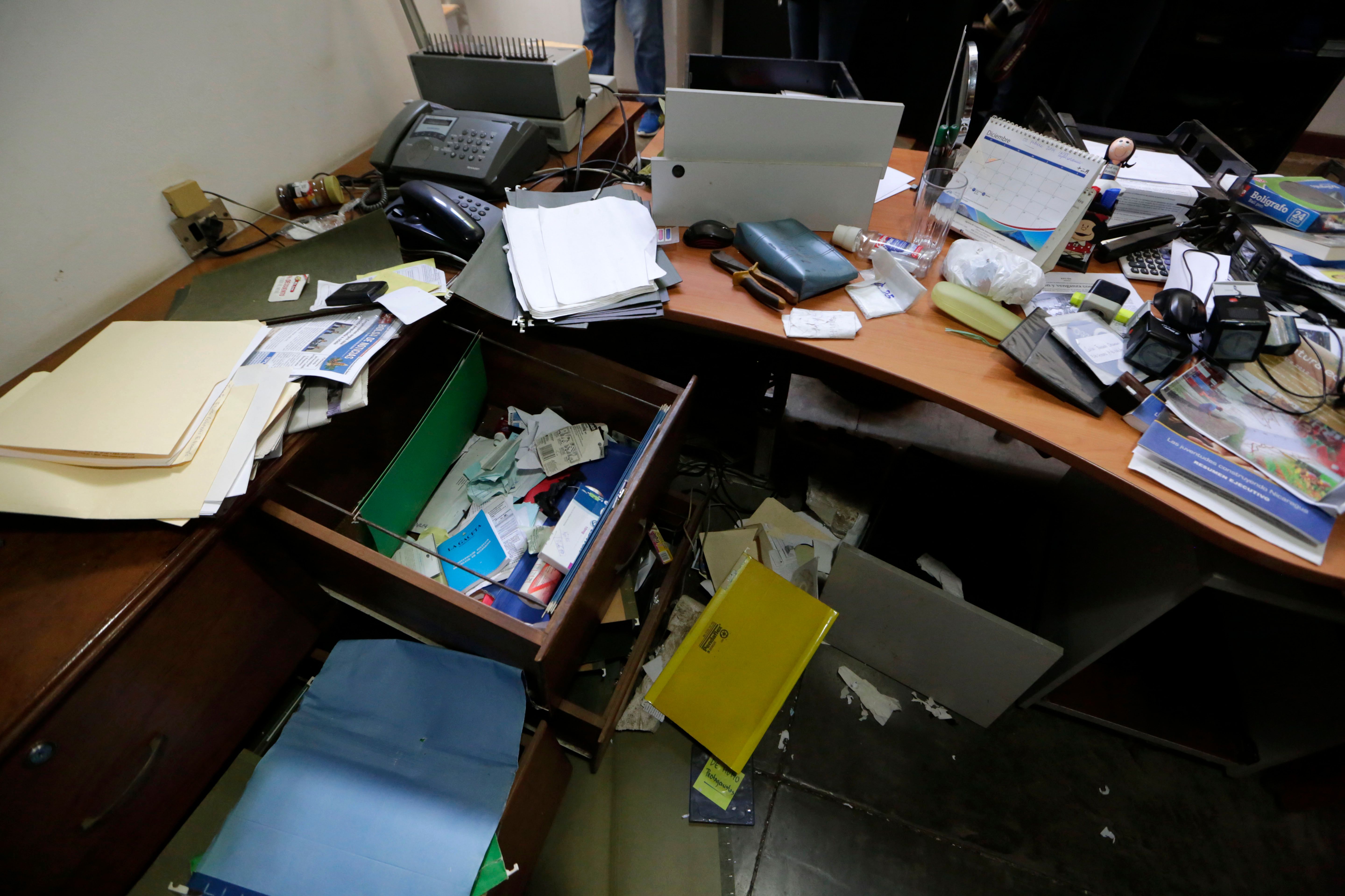 View of damages at the office of Nicaraguan journalist Carlos Fernando Chamorro, who rents at the building of the NGO Center of Investigation on Communication (CINCO) in Managua on December 14, 2018. - The Nicaraguan police raided Friday the offices of Human Rights organizations and other associations as actions against the opponents to the government of Daniel Ortega intensify, the affected denounced. Several NGOs were stripped of their legal status by the National Assembly. (Photo by Inti Ocon / AFP)