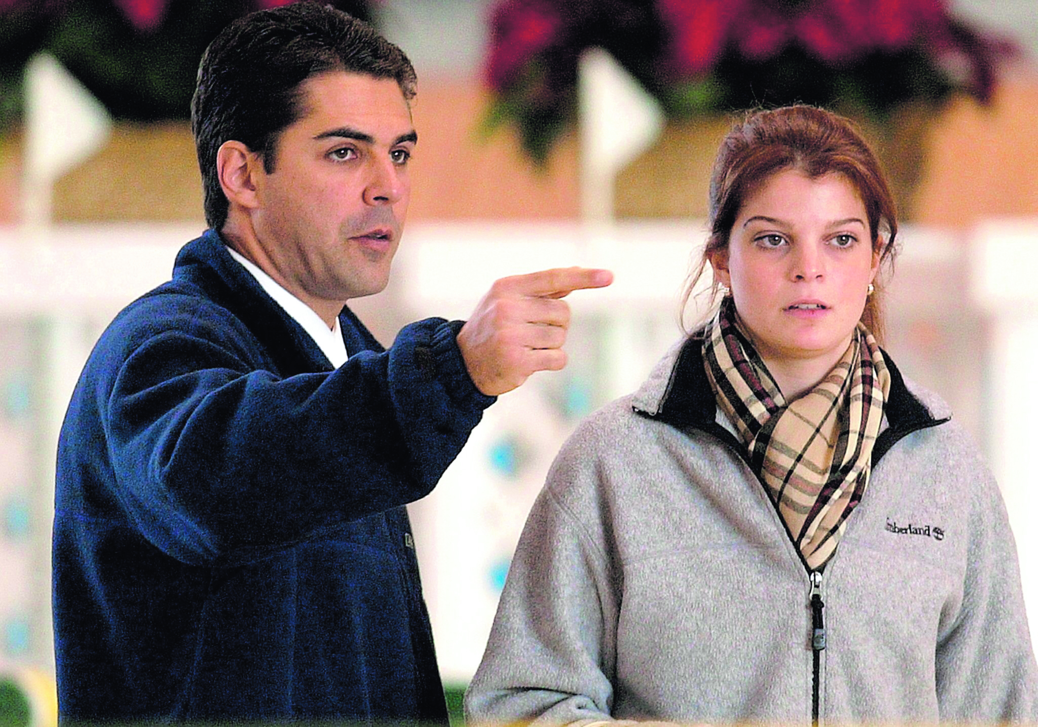(FILES) Greek millionaire Athina Onassis Roussel (R) talks with her Brazilian fiance, rider Alvaro Affonso de Miranda Neto during an international show jumping equestrian event 13 December 2003 in LarÌn, La CoruÒa, northern Spain. Athina Roussell Onassis, granddaughter and only heir of Greek shipping magnate Aristotle Onassis, will marry on 03 December 2005 Brazil's equestrian champion Alvaro Affonso "Doda" de Miranda Neto. The marriage is to take place before 400 to 750 guests in a huge mansion in Sao Paulo's swank Morumbi district, under heavy guard and off limits to paparazzi and gawkers. Doda, the 32-year-old son of one of Brazil's top industrialists. AFP PHOTO/IAGO L”PEZ