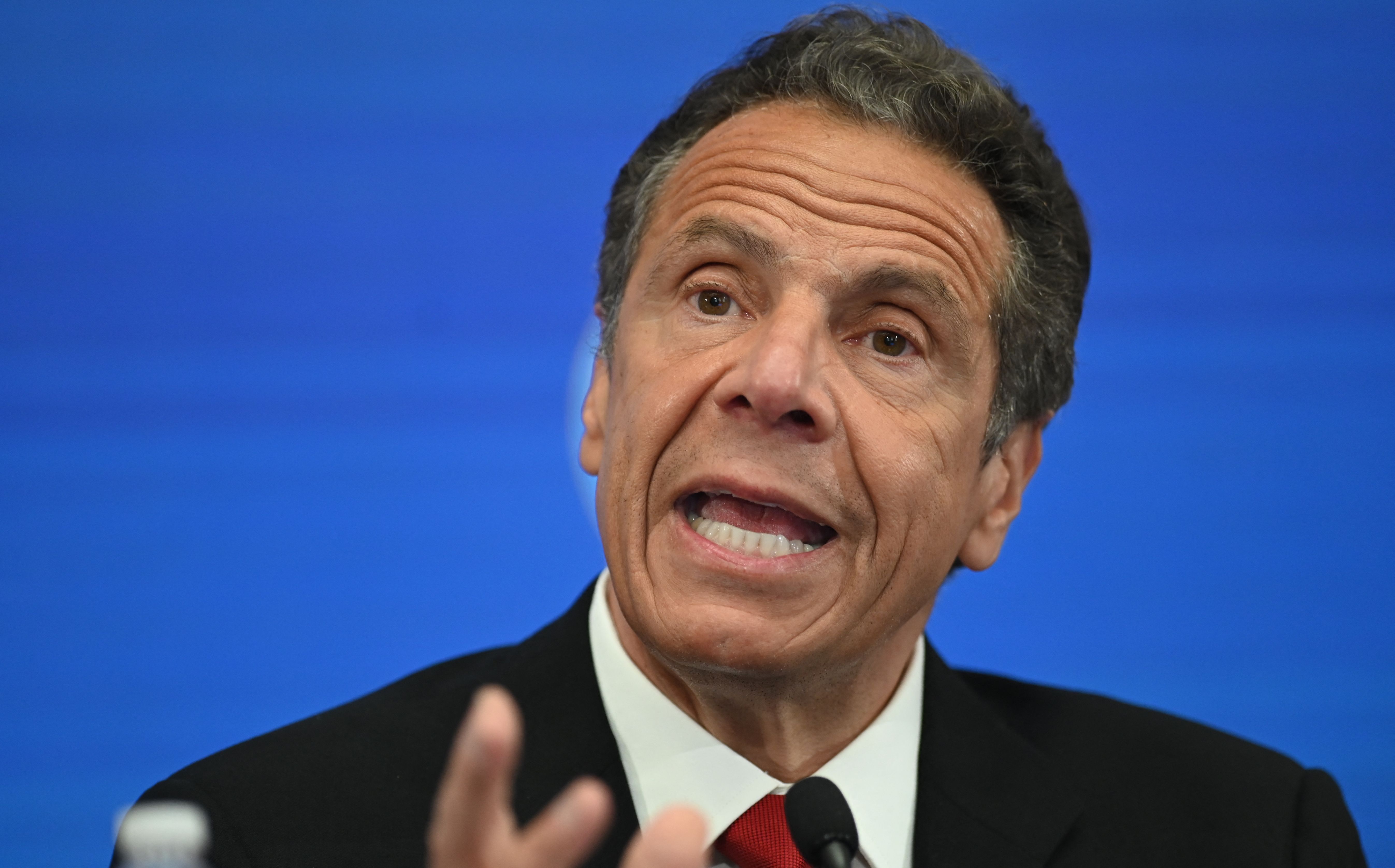 (FILES) In this file photo taken on May 26, 2020, New York Governor Andrew Cuomo speaks during a press conference at the New York Stock Exchange (NYSE) at Wall Street in New York City. - A woman who says New York Governor Andrew Cuomo groped her breast has filed a criminal complaint against the politician, US law enforcement said August 6, 2021, increasing the possibility he might be charged. The woman, who has not been named but who works as an aide to Cuomo, says the three-term governor assaulted her at his executive mansion last year. (Photo by Johannes EISELE / AFP)