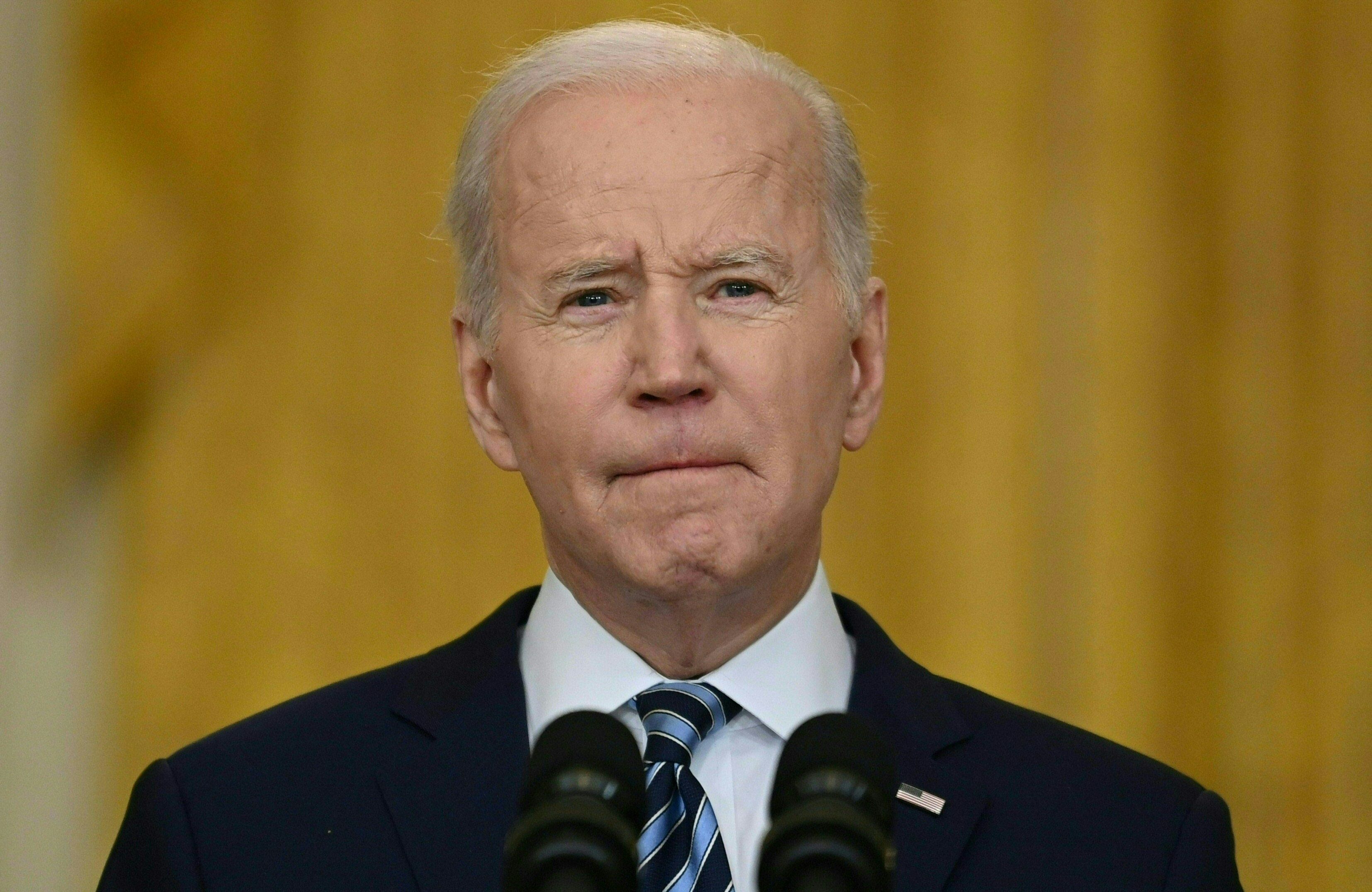 US President Joe Biden addresses the Russian invasion of Ukraine, from the East Room of the White House on February 24, 2022, in Washington, DC. - Biden announced "devastating" Western sanctions against Russia on Thursday. After a virtual, closed-door meeting, the G7 democracies said they stand firm against Russia's "threat to the rules-based international order." (Photo by Brendan SMIALOWSKI / AFP)