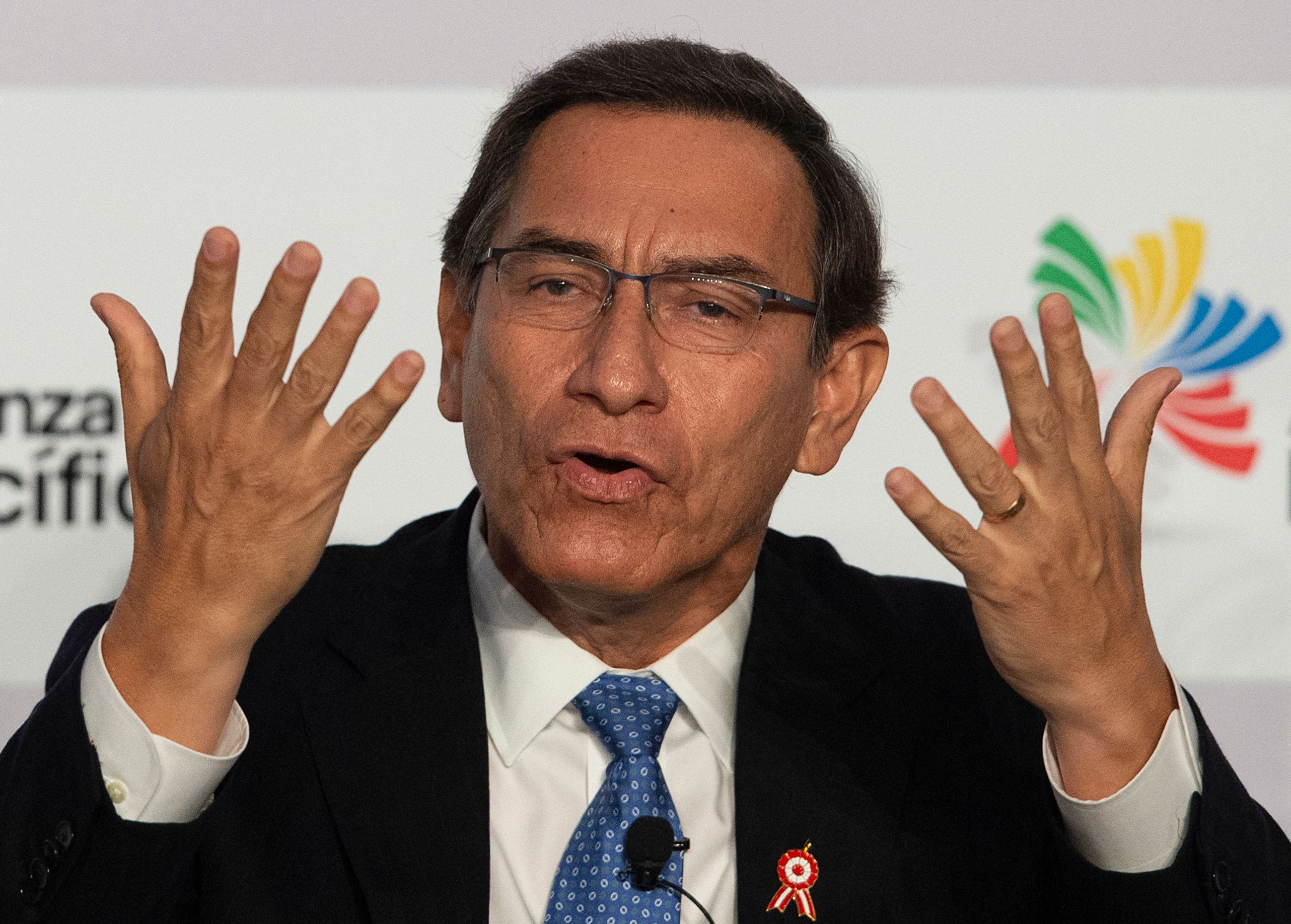 (FILES) In this file photo taken on July 5, 2019 then Peruvian President Martin Vizcarra speaks during "The Pacific Alliance for the New Decade" meeting in the framework of the Pacific Alliance Summit, in Lima. - Former Peruvian President Martin Vizcarra reacted angrily on March 13, 2021 to the request for 18 months of preventive detention against him, requested by a prosecutor, in the framework of investigations for alleged corruption while he was governor of the southern region of Moquegua in 2014. Vizcarra, 57, rejected any attempt to evade justice and assured that he has testified before the prosecutor five times, since the case was opened. (Photo by Cris BOURONCLE / AFP)
