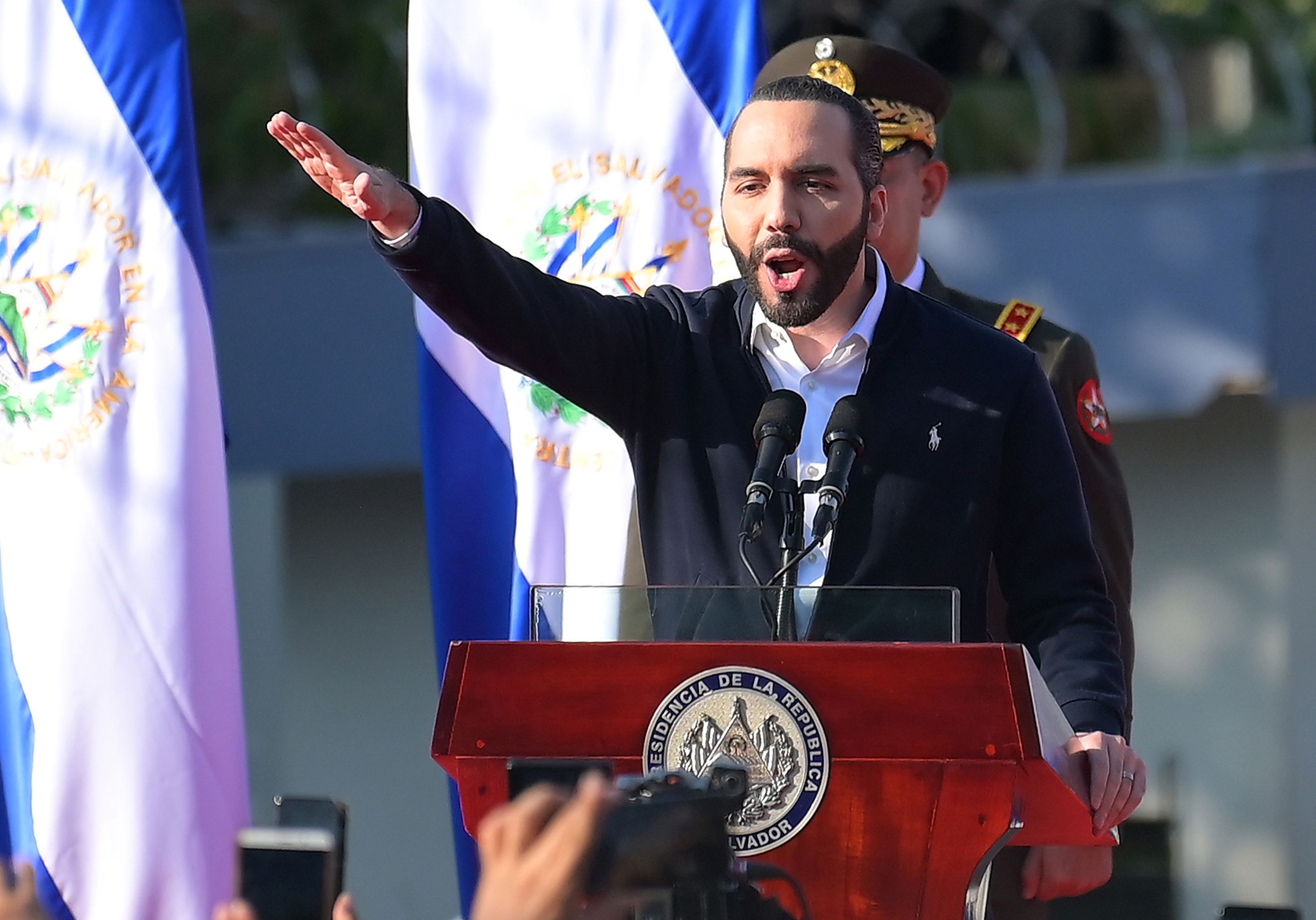 (FILES) In this file photo taken on February 09, 2020 Salvadoran President Nayib Bukele gestures as he speaks to supporters during a protest outside the Legislative Assembly to make pressure on deputies to approve a loan to invest in security, in San Salvador. - The harsh treatment of gang members in prisons and the determination to confine those who violate the quarantine imposed due to the coronavirus pandemic, have garnered support for President Nayib Bukele in El Salvador and criticism outside the country on May, 2020. (Photo by MARVIN RECINOS / AFP)