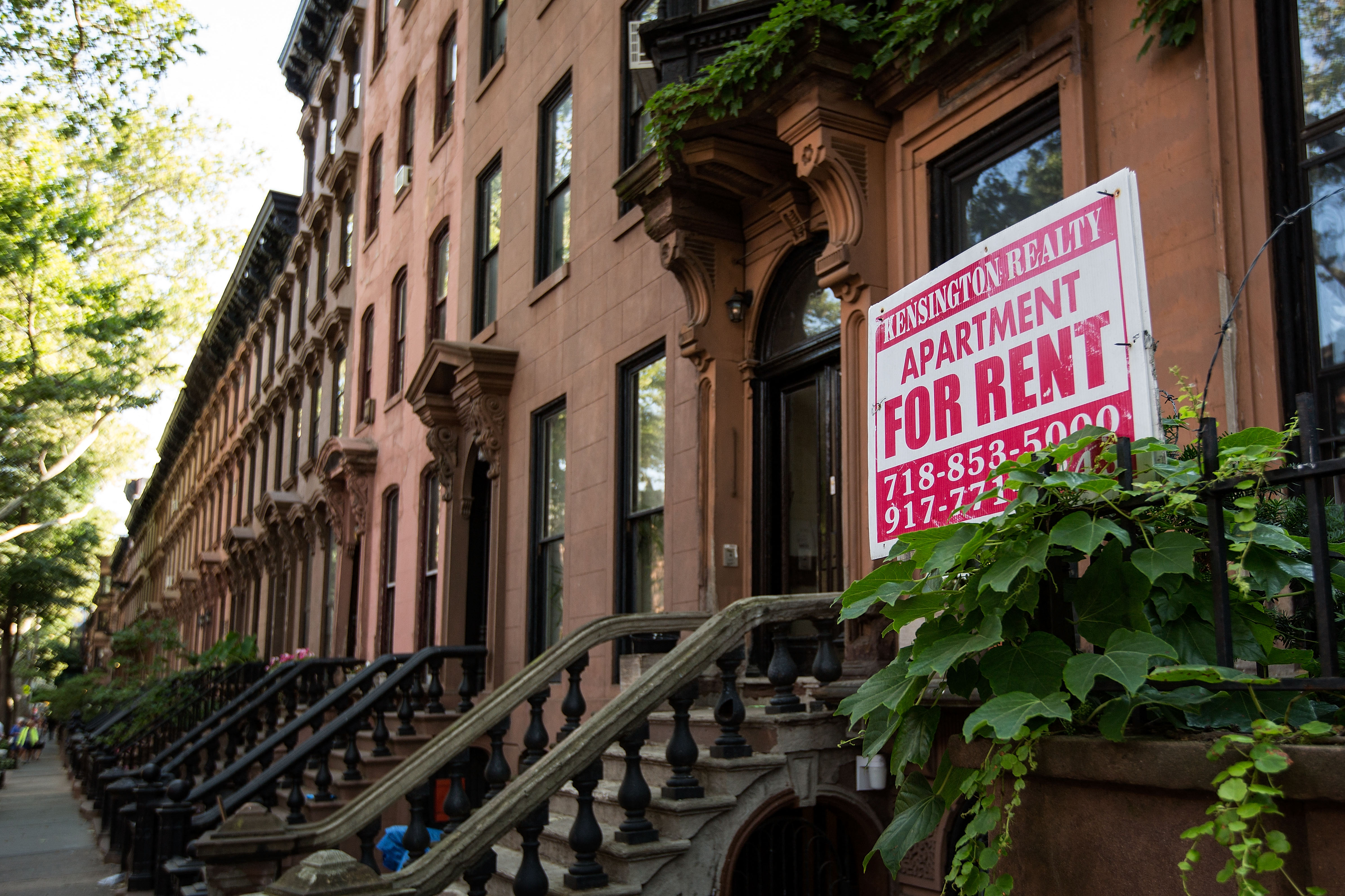 (FILES) In this file photo taken on June 23, 2016 a sign advertises an apartment for rent along a row of brownstone townhouses in the Fort Greene neighborhood in the Brooklyn borough of New York City. - As rents continue to climb, New York City faces a housing crisis that�s making it harder for middle- and low-income people to live here. (Photo by Drew Angerer / GETTY IMAGES NORTH AMERICA / AFP)