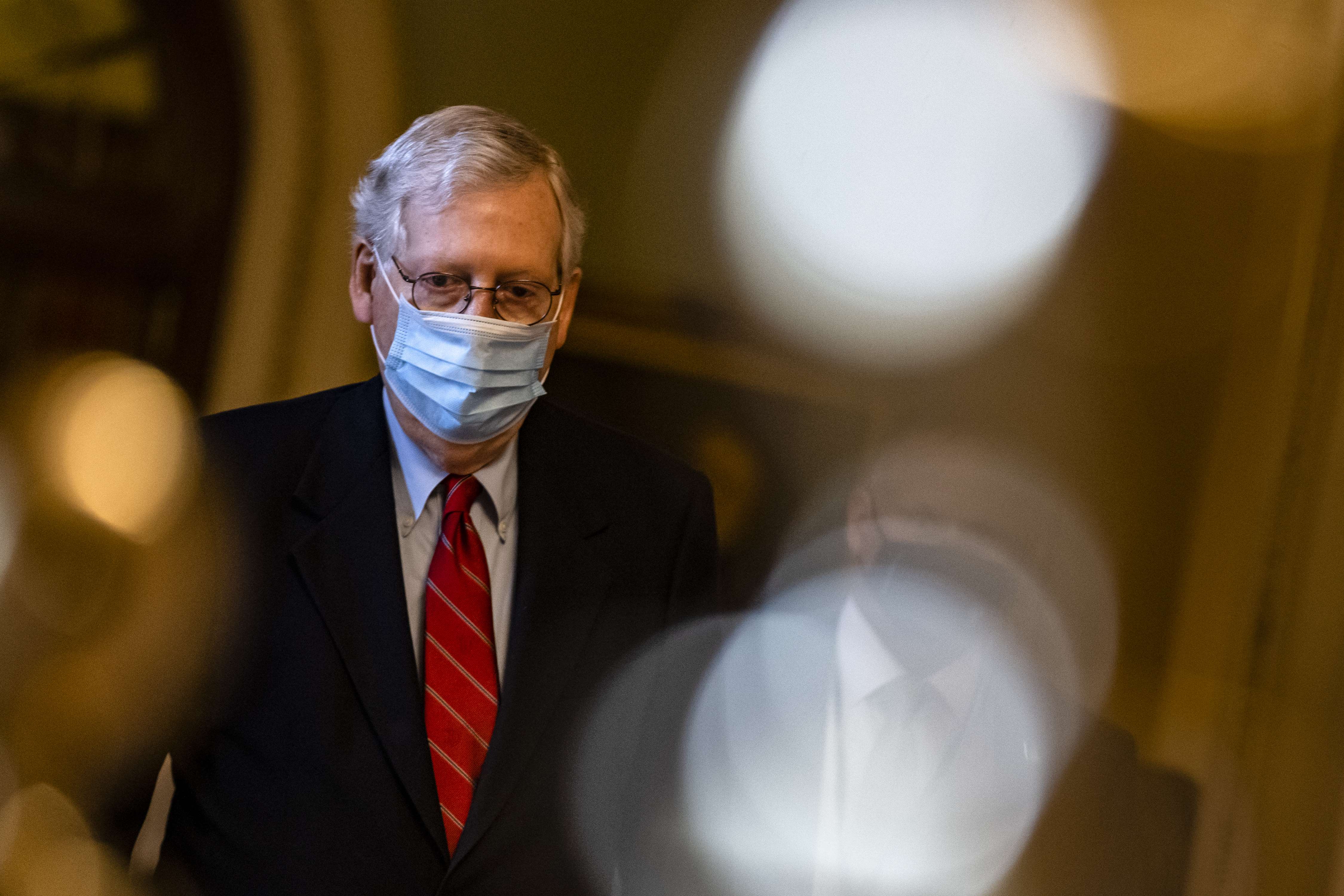 WASHINGTON, DC - DECEMBER 20: Senate Majority Leader Mitch McConnell (R-KY) heads to his office from the floor of the Senate on December 20, 2020 in Washington, DC. Republicans and Democrats in the Senate finally came to an agreement on the coronavirus relief bill and a vote is expected later today. Samuel Corum/Getty Images/AFP
== FOR NEWSPAPERS, INTERNET, TELCOS & TELEVISION USE ONLY ==
