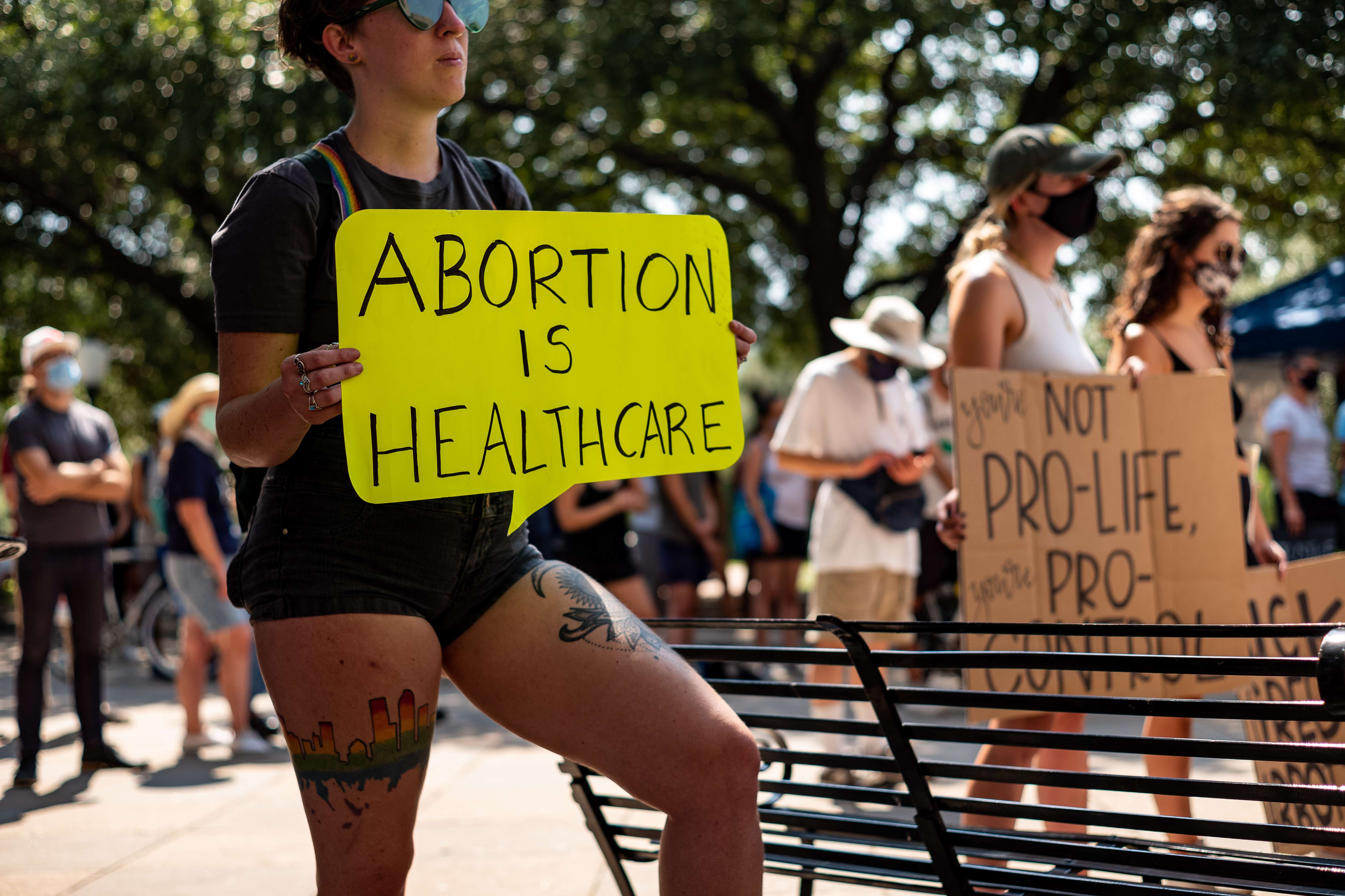 AUSTIN, TX - SEPTEMBER 11: A woman carries a sign declaring abortion a part of healthcare at a rally at the Texas State Capitol on September 11, 2021 in Austin, Texas. Texas Lawmakers recently passed several pieces of conservative legislation, including SB8, which prohibits abortions in Texas after a fetal heartbeat is detected on an ultrasound, usually between the fifth and sixth weeks of pregnancy. Jordan Vonderhaar/Getty Images/AFP
== FOR NEWSPAPERS, INTERNET, TELCOS & TELEVISION USE ONLY ==
