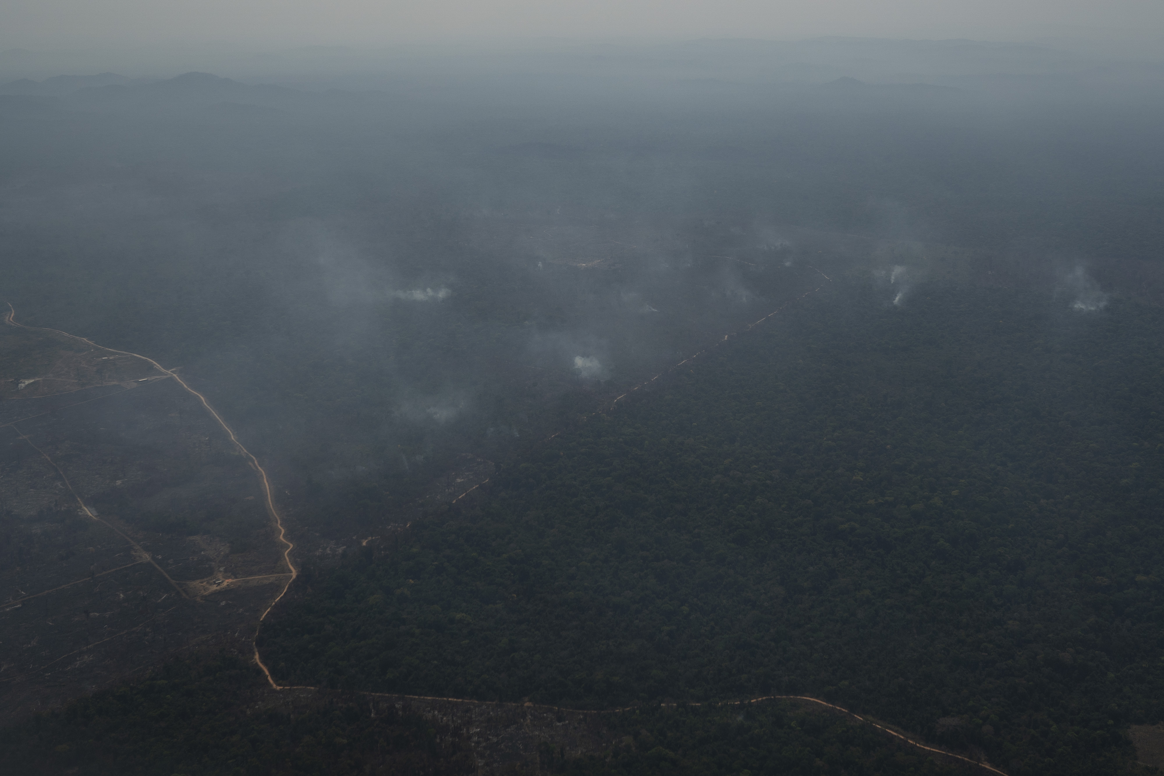 Smoke rises from several burning fires in Altamira, Para state, Brazil, Wednesday, Aug. 28, 2019. Brazilian President Jair Bolsonaro said he has accepted four planes from Chile to help fight Amazon fires, and he accused the French president of portraying himself as "the one and only person" concerned about the environment. (AP Photo/Leo Correa)