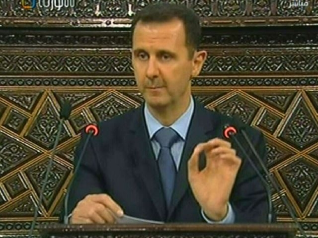 --RESTRICTED TO EDITORIAL USE - MANDATORY CREDIT "AFP PHOTO / HO / SYRIAN TV" - NO MARKETING NO ADVERTISING CAMPAIGNS - DISTRIBUTED AS A SERVICE TO CLIENTS --
A TV grab taken from Syrian TV shows Syria's President Bashar al-Assad addressing the Parliament on March 30, 2011 in a highly anticipated speech in which he is expected to announce reforms in response to protests demanding major changes. AFP PHOTO / HO / SYRIAN TV