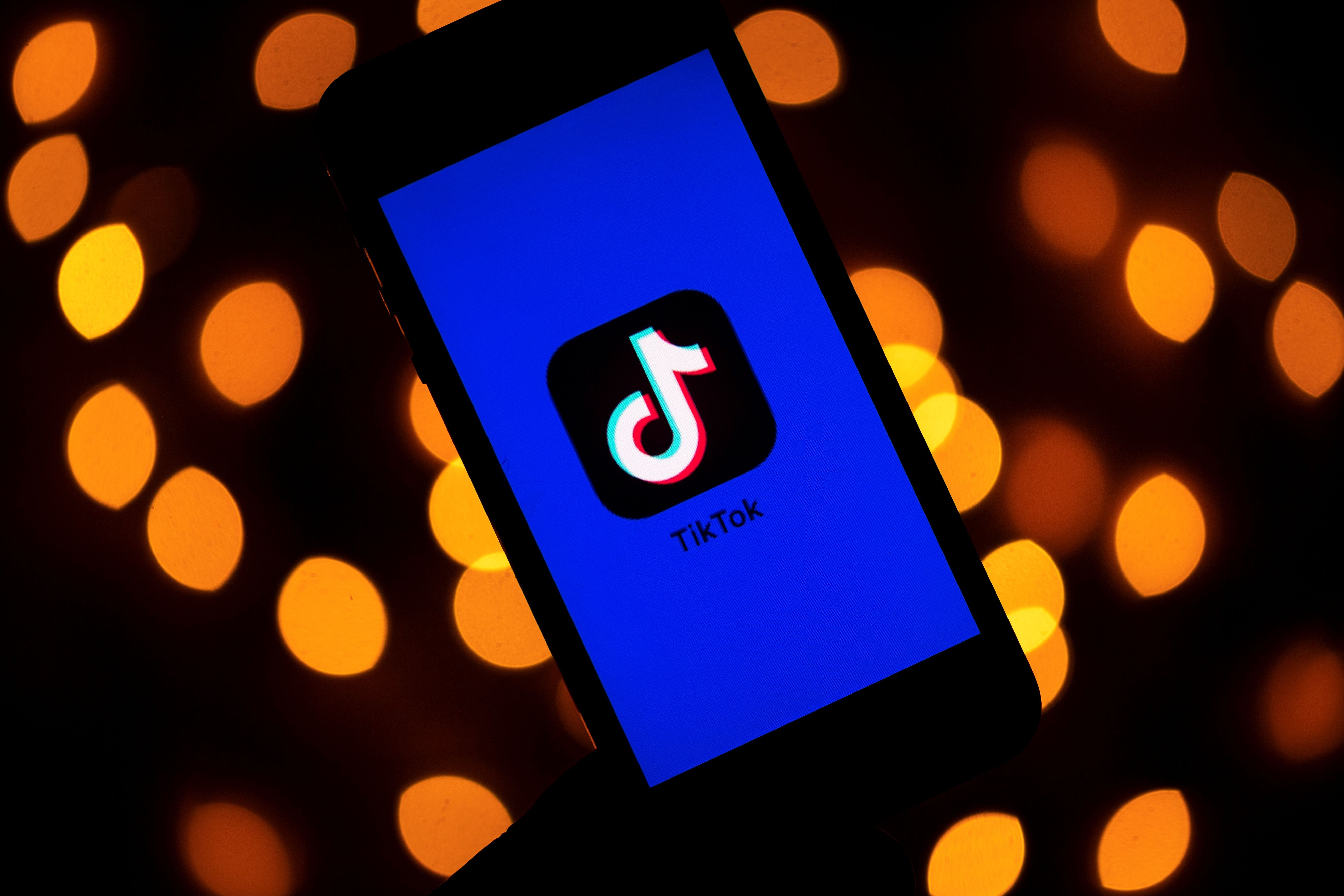 (FILES) This file photo taken on November 21, 2019 shows the logo of the social media video sharing app Tiktok displayed on a tablet screen in Paris. Microsoft announced on August 2, 2020 it would continue talks to acquire the US operations of popular video-sharing app TikTok, after meeting with President Donald Trump who seemingly backed off his earlier threats to ban the Chinese-owned platform. (Photo by Lionel BONAVENTURE / AFP)
