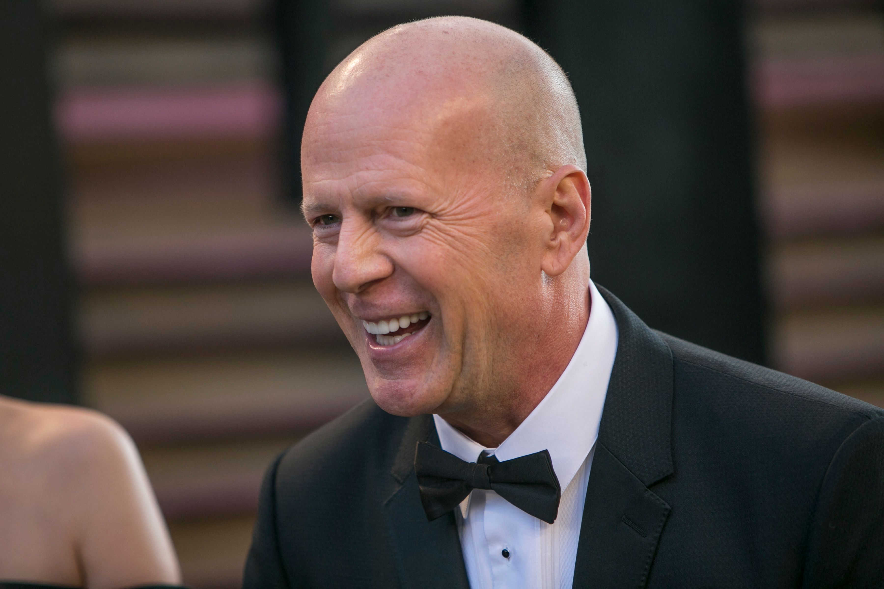 (FILES) In this file photo taken on March 02, 2014, Bruce Willis arrives to the 2014 Vanity Fair Oscar Party in West Hollywood, California. - Willis, star of the "Die Hard" franchise, is to retire from acting due to an illness affecting his cognitive faculties, his family announced on March 30, 2022. A post on Instagram signed by his family said Willis had developed aphasia -- a language disorder that robs people of their ability to communicate. "Bruce has been experiencing some health issues and has recently been diagnosed with aphasia, which is impacting his cognitive abilities," read the post. (Photo by ADRIAN SANCHEZ-GONZALEZ / AFP)