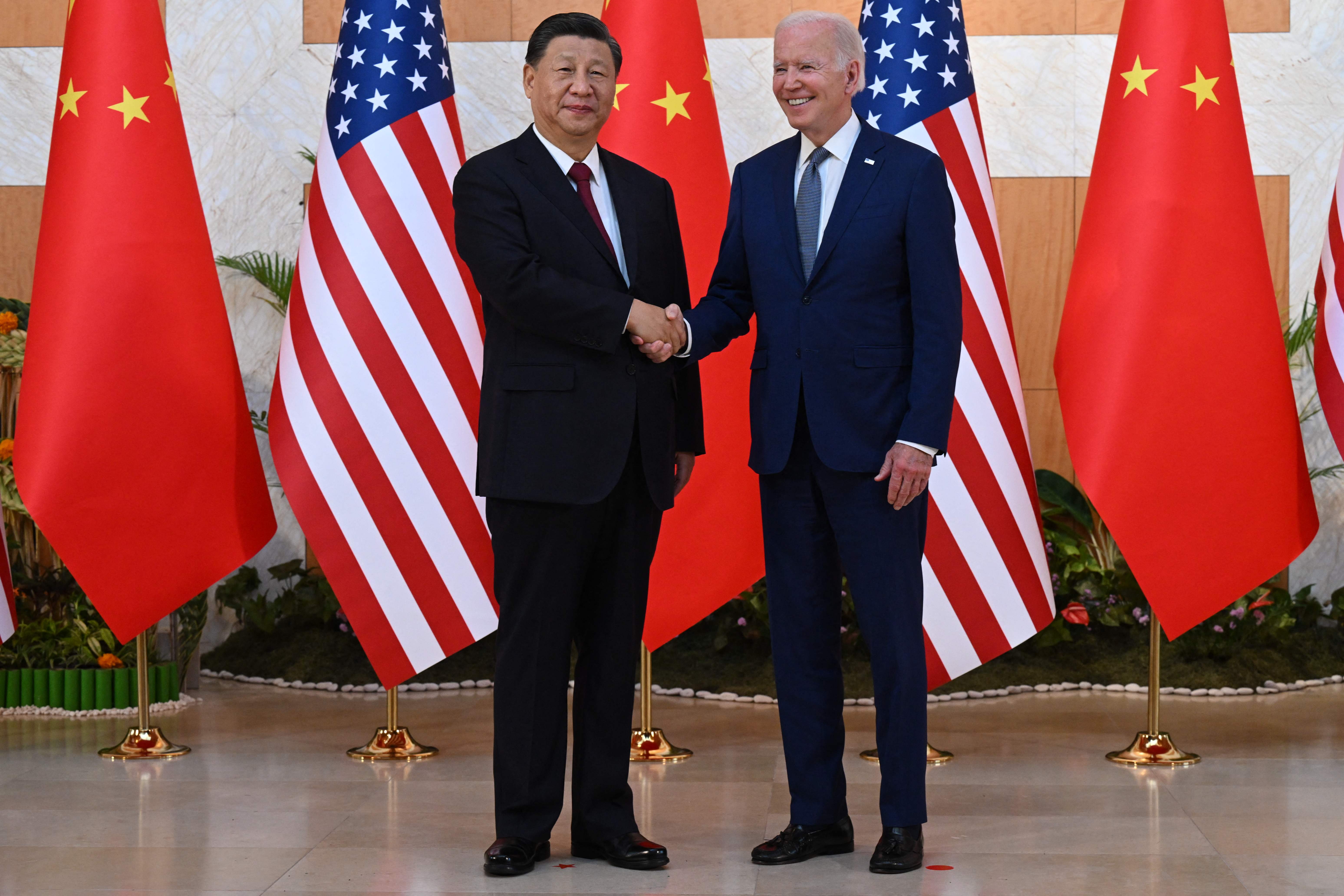 US President Joe Biden (R) and China's President Xi Jinping (L) meet on the sidelines of the G20 Summit in Nusa Dua on the Indonesian resort island of Bali on November 14, 2022. (Photo by SAUL LOEB / AFP)