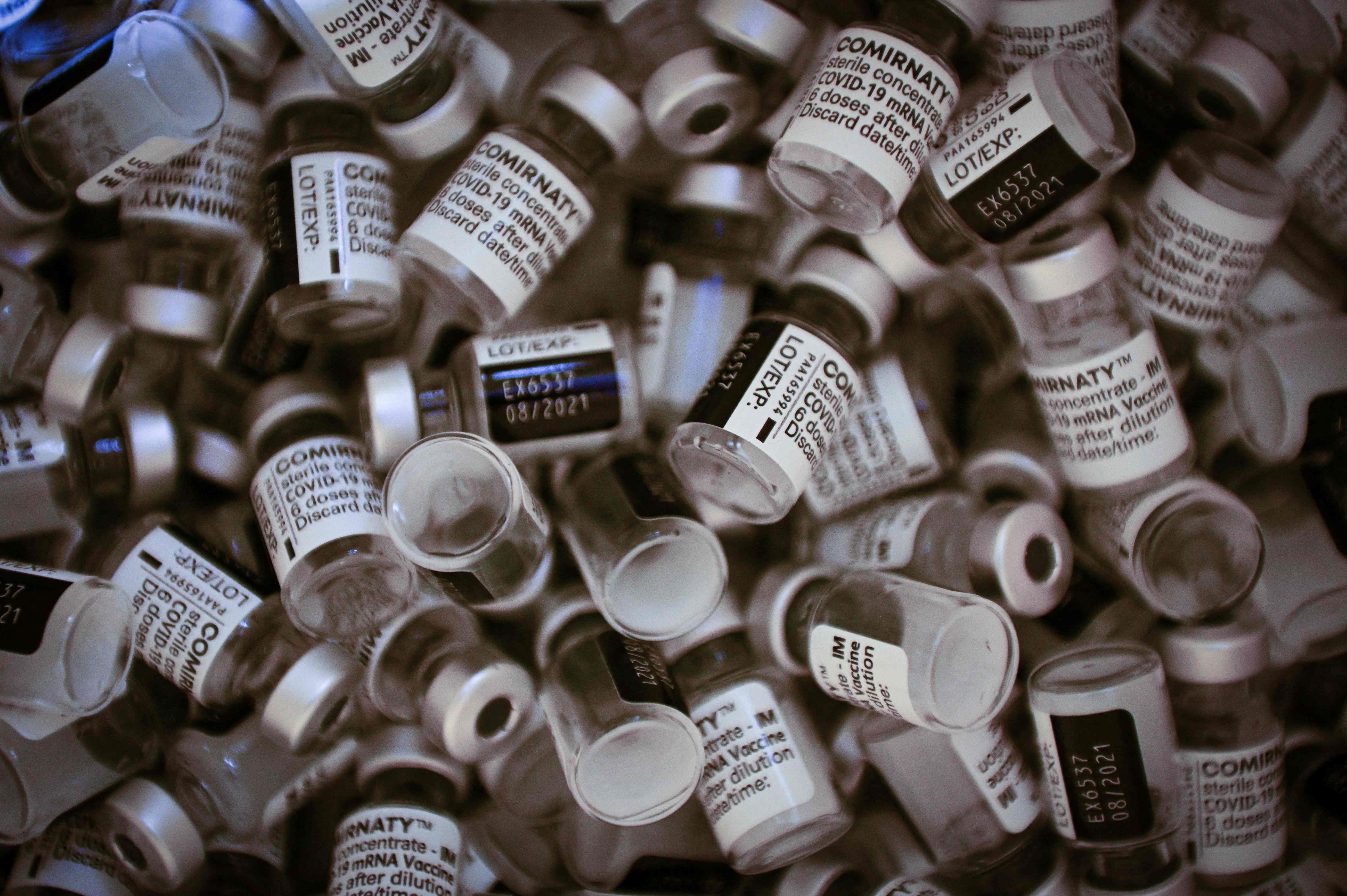 A picture shows vials of Pfizer-BioNTech vaccine at a Covid-19 vaccination center in Paris, on May 8, 2021, amid the campaign of vaccination against the coronavirus. (Photo by Martin BUREAU / AFP)