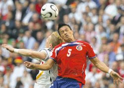 Costa Rica's Gilberto Martinez, front, and Germany's Bastian Schweinsteiger battle for a high ball during the Germany v Costa Rica Group A soccer match at World Cup stadium, Munich, Germany, Friday June 9, 2006. The other teams in Group A are Ecuador and Poland. (AP Photo/Frank Augstein) ** MOBILE/PDA USAGE OUT **