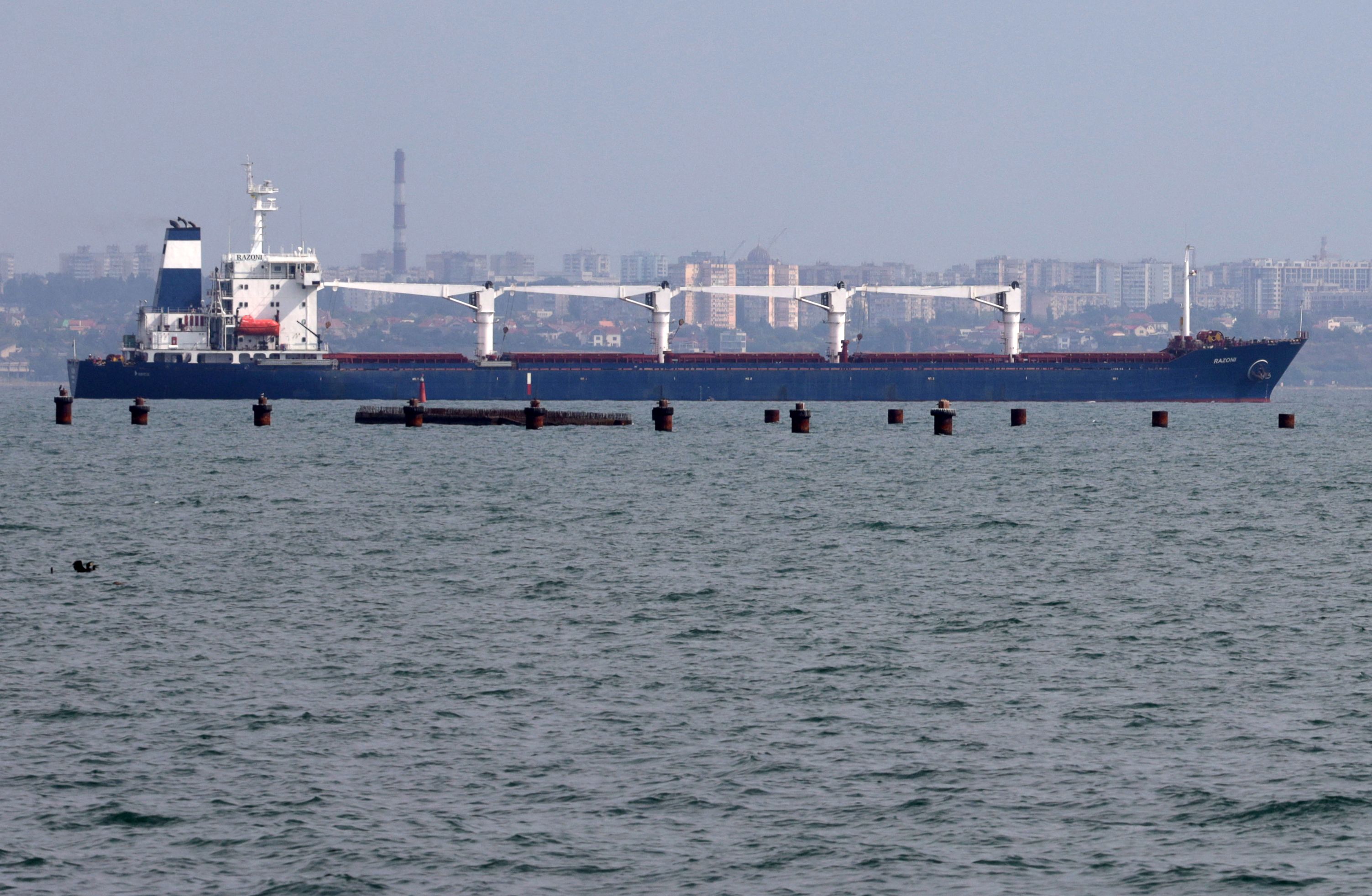 Bulk carrier M/V Razoni, carrying a cargo of 26,000 tonnes of corn, leaves Ukraine�s port of Odessa, en route to Tripoli in Lebanon, on August 1, 2022, amid Russia's military invasion launched on Ukraine. - The first shipment of Ukrainian grain left the port of Odessa on August 1 under the under the Black Sea Grain Initiative deal signed in Istanbul, on 22 July, aimed at relieving a global food crisis following Russia's invasion of its neighbour, the Turkish defence ministry said. (Photo by Oleksandr GIMANOV / AFP)