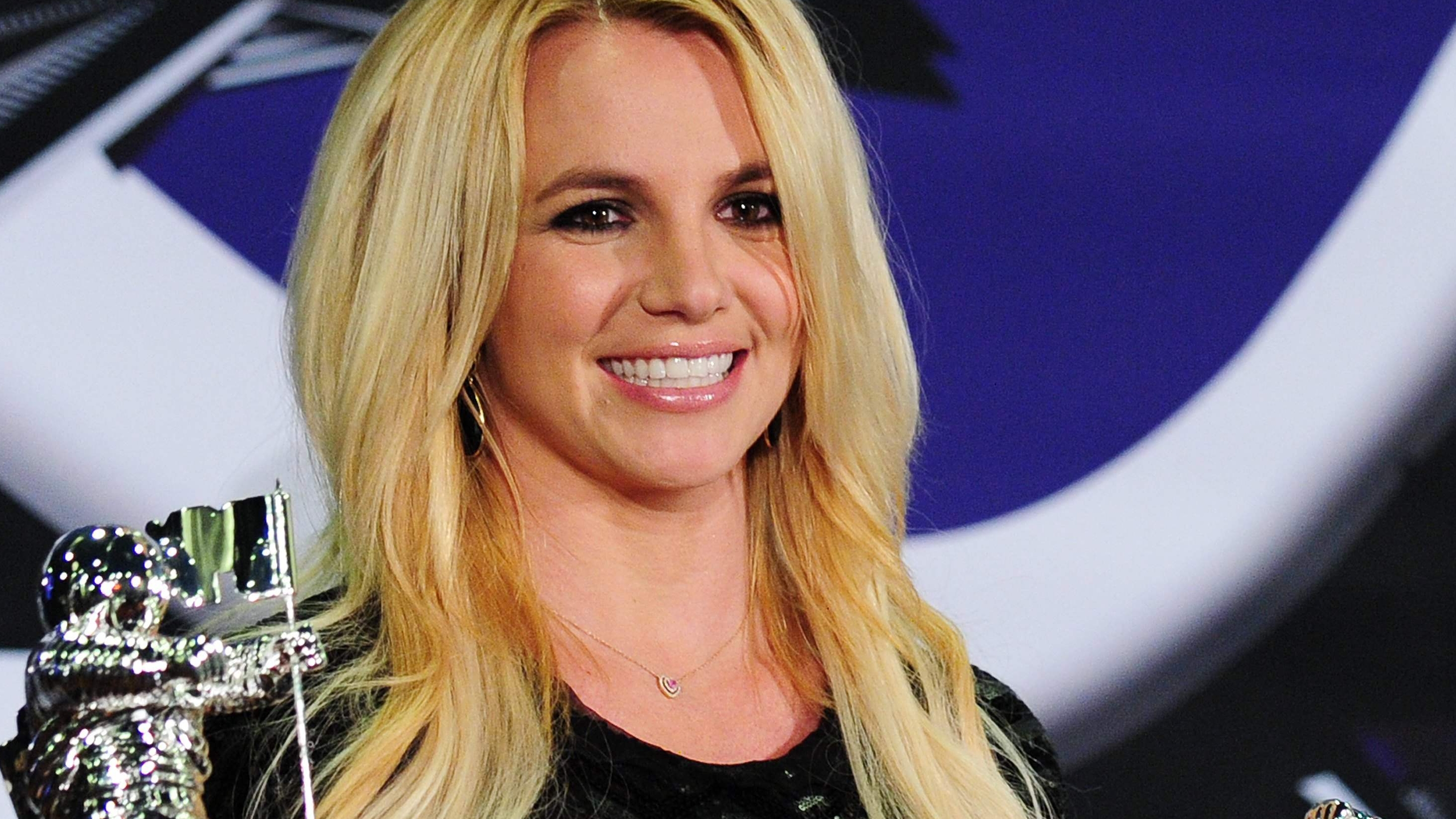 (FILES) In this file photo Britney Spears holds her Best Pop Video Award and her Michael Jackson Video Vanguard Award in the press room at the 2011 MTV Video Music Awards (VMAs) August 28, 2011 at the Noika Theatre in downtown Los Angeles, California. - A Los Angeles court denied Britney Spears' request to eject her father from a guardianship arrangement that gives him control of her affairs, US media reported on July 1, 2021. The decision comes a week after the singer made an impassioned plea to end the "abusive" conservatorship during which she said she has been medicated to control her behavior, prohibited from making decisions on friendships or finances, and prevented from having a contraceptive implant removed, despite wanting more children. (Photo by Frederic J. BROWN / AFP)