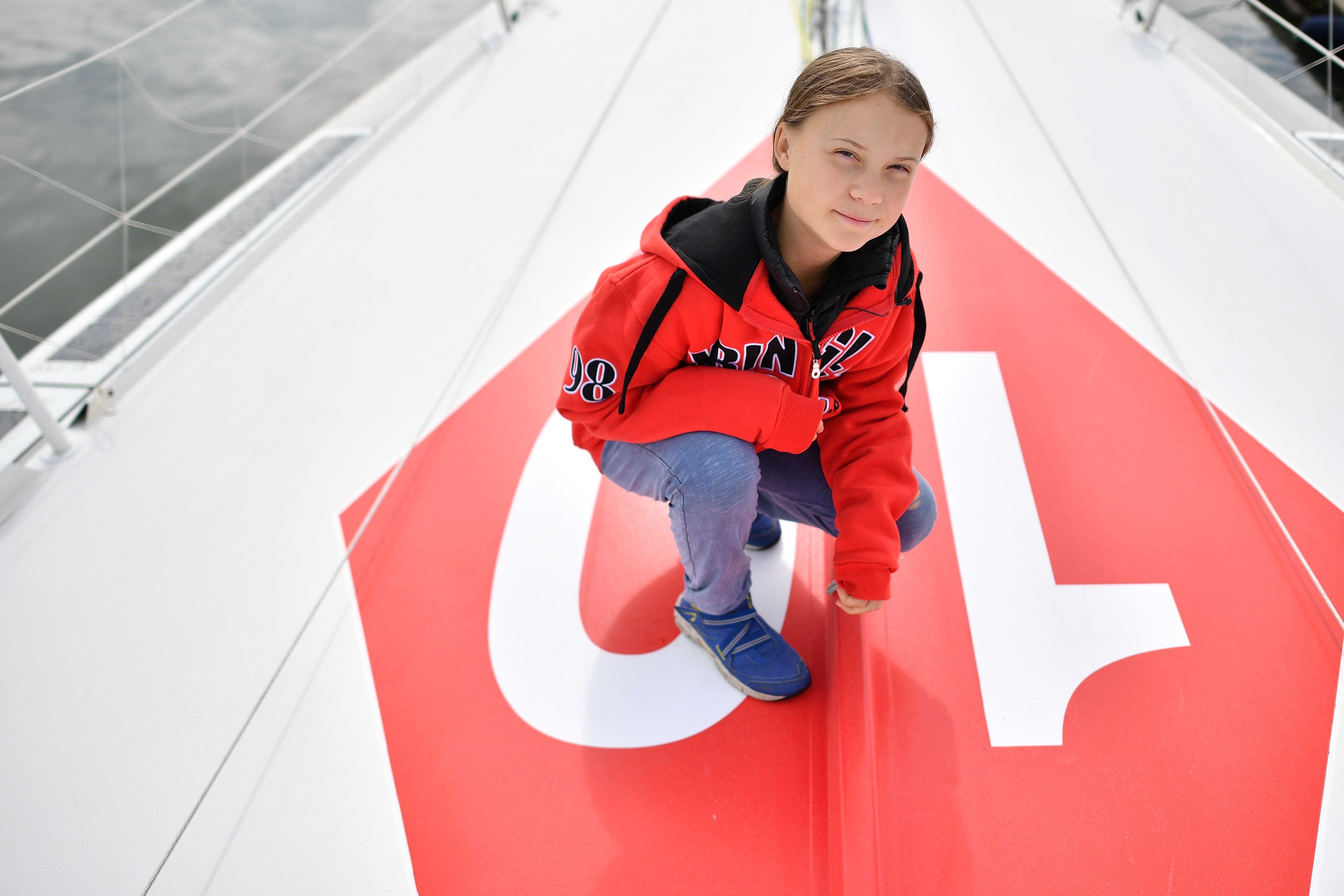 Swedish climate activist Greta Thunberg poses for a photograph during an inteview with AFP onboard the Malizia II sailing yacht at the Mayflower Marina in Plymouth, southwest England, on August 13, 2019 ahead of her journey across the Atlantic to New York where she will attend the UN Climate Action Summit next month. - A year after her school strike made her a figurehead for climate activists, Greta Thunberg believes her uncompromising message about global warming is getting through -- even if action remains thin on the ground. The 16-year-old Swede, who sets sail for New York this week to take her message to the United States, has been a target for abuse but sees that as proof she is having an effect. (Photo by Ben STANSALL / AFP)