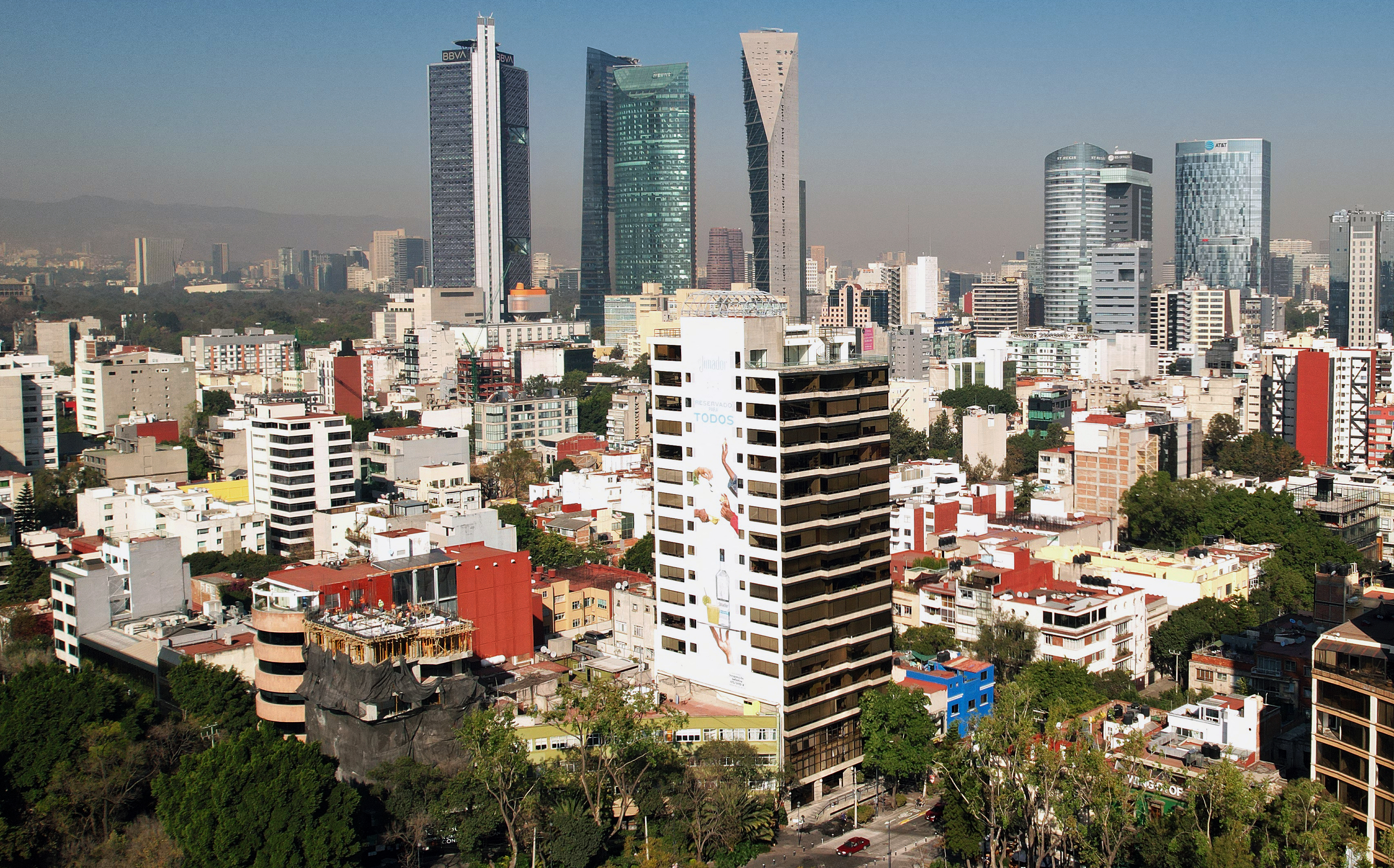 View taken on February 2, 2023 of the Roma Norte neighborhood in Mexico City. - Mexico City is attracting a rising number of tourists and foreigners who rent accommodation through online platforms, but following the deaths of several people from suspected carbon monoxide poisoning, authorities are seeking to regulate online rental websites. (Photo by CARLO ECHEGOYEN / AFP)