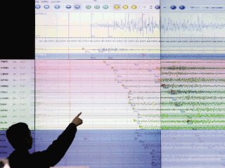 A geologist looks at a screen showing the seismograph reading of the powerful earthquake that rocked Sumatra island at the office of Indonesia's meteorological agency in Jakarta, Indonesia, Wednesday, Sept. 30, 2009. The U.S. Geological Survey said the quake had a preliminary magnitude of 7.9, and struck 30 miles (50 kilometers) off the coast of Sumatra. (AP Photo/Irwin Fedriansyah)