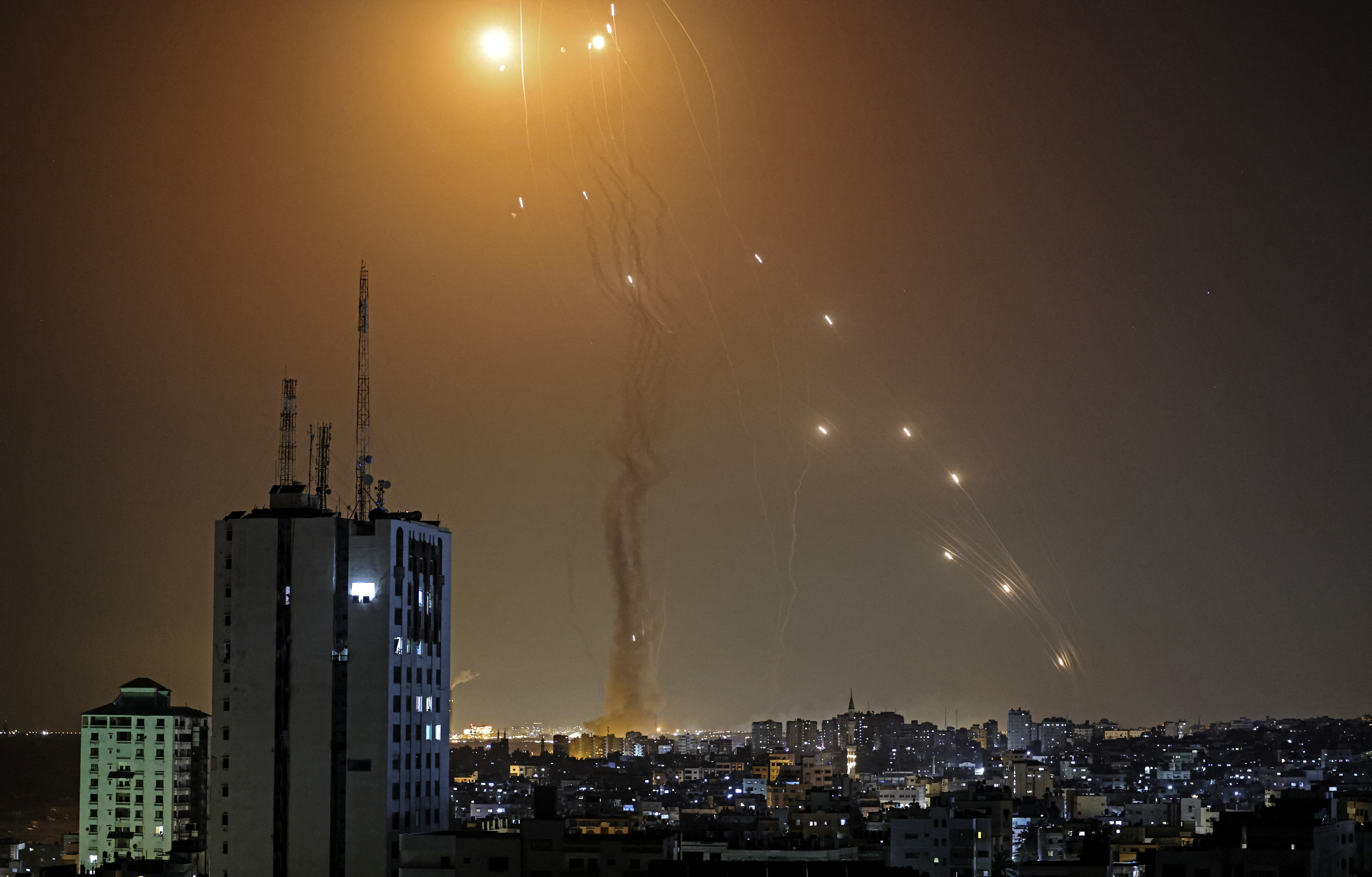 A rocket launched from Gaza city controlled by the Palestinian Hamas movement, is intercepted by Israel's Iron Dome aerial defence system, on May 11, 2021. (Photo by MAHMUD HAMS / AFP)