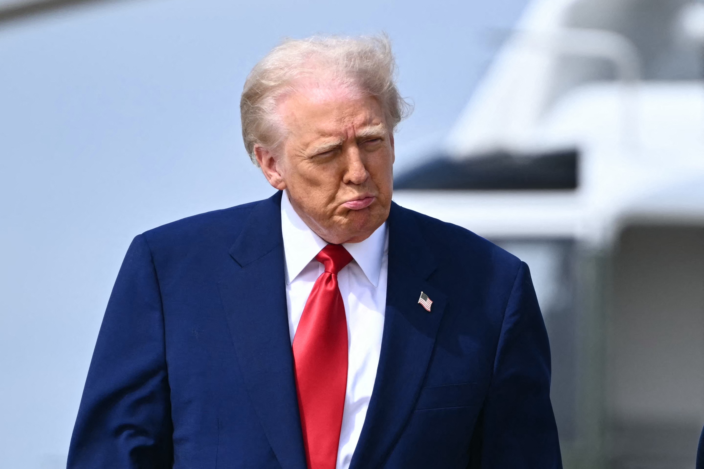 US President Donald Trump walks to board Air Force One at Joint Base Andrews in Maryland on April 3, 2025. Trump is travelling to the Trump National Doral Golf Club in Florida before going to his Mar-a-Lago resort. (Photo by Mandel NGAN / AFP)