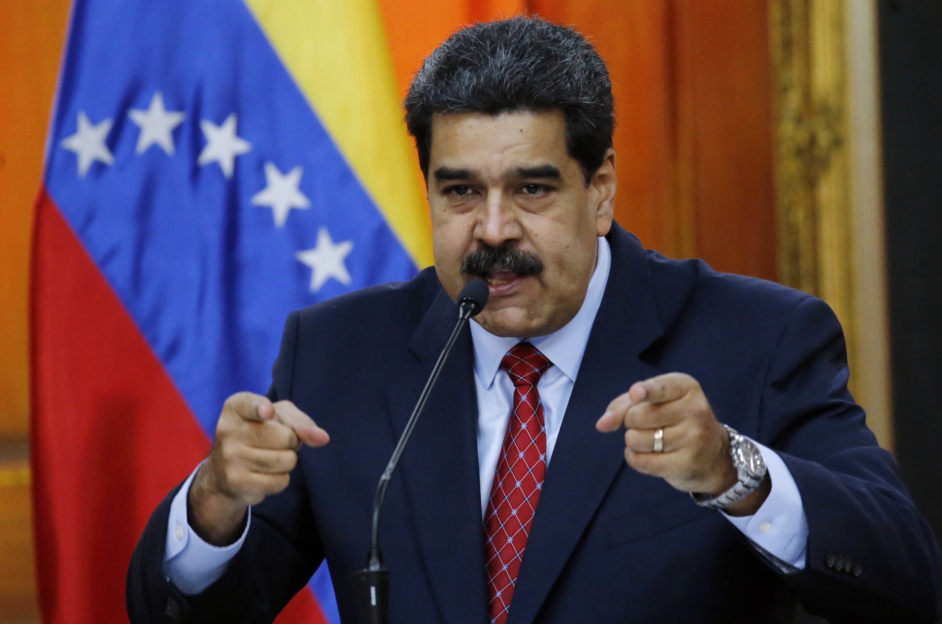 Venezuelan President Nicolas Maduro gives a press conference at Miraflores presidential palace in Caracas, Venezuela, Friday, Jan. 25, 2019, amid a political power struggle between him and an opposition leader who has declared himself interim president. (AP Photo/Ariana Cubillos)