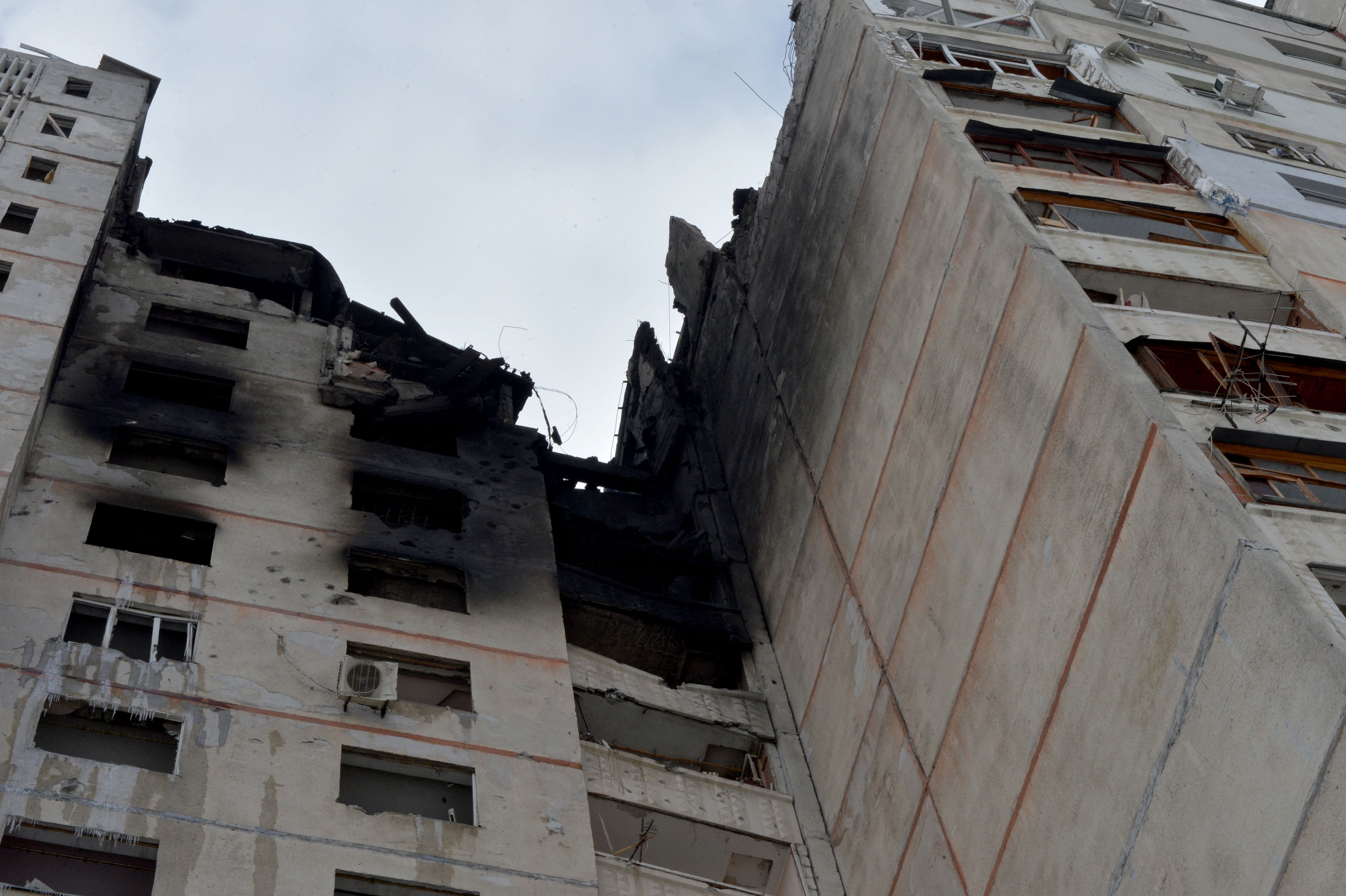EDITORS NOTE: Graphic content / The burnt out remains of a building destroyed by Russian army shelling in the second largest Ukrainian city of Kharkiv, in the east of the country on March 6, 2022. - On the eleventh day of Russia's invasion of Ukraine on March 6, 2022, Russian forces pressed a siege of the key southern port of Mariupol and destroyed an airport in the west of the country. The Ukrainian capital Kyiv remains under Ukrainian control as does Kharkiv in the east, with the overall picture of the Russian ground advance little changed over the last 24 hours in the face of fierce Ukrainian resistance. (Photo by Sergey BOBOK / AFP)