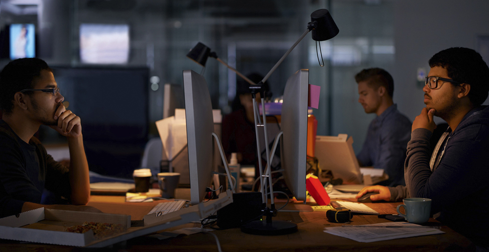 Cropped shot of a group of young coworkers working in a dimly-lit officehttp://195.154.178.81/DATA/i_collage/pi/shoots/783867.jpg