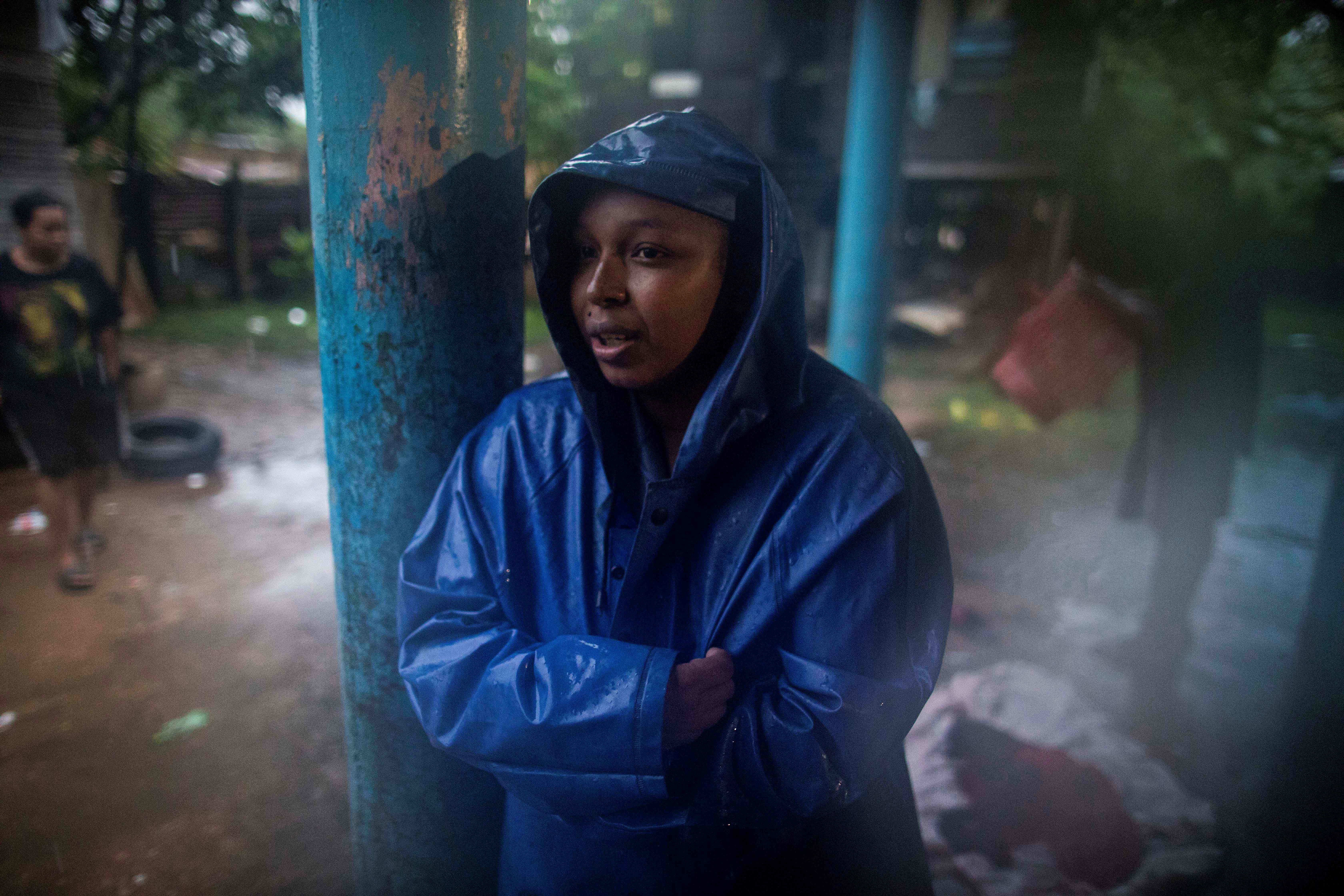 A woman stands in a shelter while waiting for the passage of Hurricane Eta, in Bilwi, Puerto Cabezas, Nicaragua, on November 2, 2020. - Eta rapidly intensified to a Category 4 hurricane on Monday as it bore down on the Caribbean coast of Nicaragua and Honduras, threatening the Central American countries with catastrophic winds and floods. (Photo by INTI OCON / AFP)