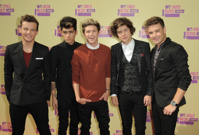 Members of the British band One Direction, from left, Louis Tomlinson, Zayn Malik, Niall Horan, Harry Styles and Liam Payne arrive at the MTV Video Music Awards on Thursday, Sept. 6, 2012, in Los Angeles. (Photo by Jordan Strauss/Invision/AP)