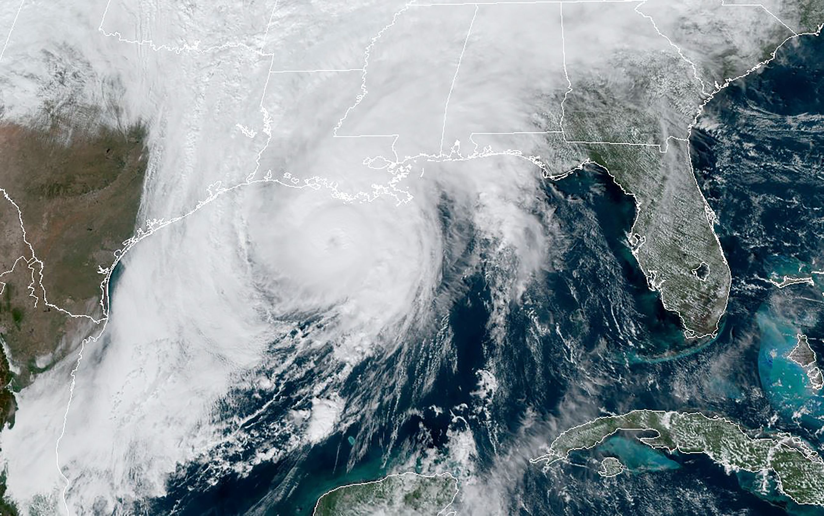 This RAMMB/NOAA satellite image shows Hurricane Zeta moving in the US Gulf Coast towards Louisiana on October 28, 2020, at 17:40 UTC. - Hurricane Zeta was set to slam the southern United States on October 28, 2020, bringing dangerous winds and storm surges to Louisiana, which has been hit repeatedly during a busy hurricane season. Zeta, packing sustained winds of 90 miles (150 kilometers) per hour, has strengthened and is predicted to make landfall in southeastern Louisiana before moving along the Mississippi coast. (Photo by Handout / RAMMB/NOAA/NESDIS / AFP) / RESTRICTED TO EDITORIAL USE - MANDATORY CREDIT "AFP PHOTO / RAMMB/NOAA" - NO MARKETING - NO ADVERTISING CAMPAIGNS - DISTRIBUTED AS A SERVICE TO CLIENTS