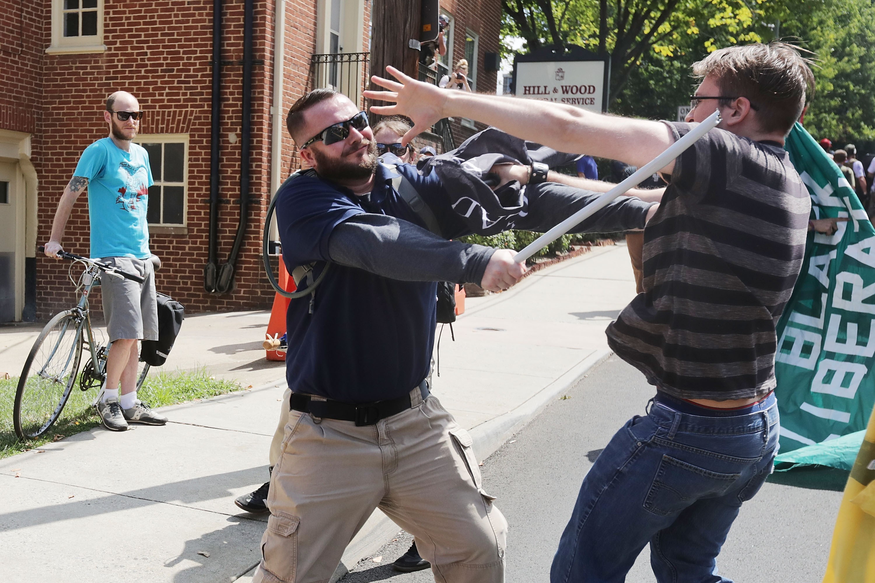 CHARLOTTESVILLE, VA - AUGUST 12: White nationalists, neo-Nazis and members of the "alt-right" clash with counter-protesters in the street after the "Unite the Right" rally was delcared a unlawful gathering by Virginia State Police August 12, 2017 in Charlottesville, Virginia. After clashes with anti-fascist protesters and police the rally was declared an unlawful gathering and people were forced out of Lee Park, where a statue of Confederate General Robert E. Lee is slated to be removed. Chip Somodevilla/Getty Images/AFP
== FOR NEWSPAPERS, INTERNET, TELCOS & TELEVISION USE ONLY ==