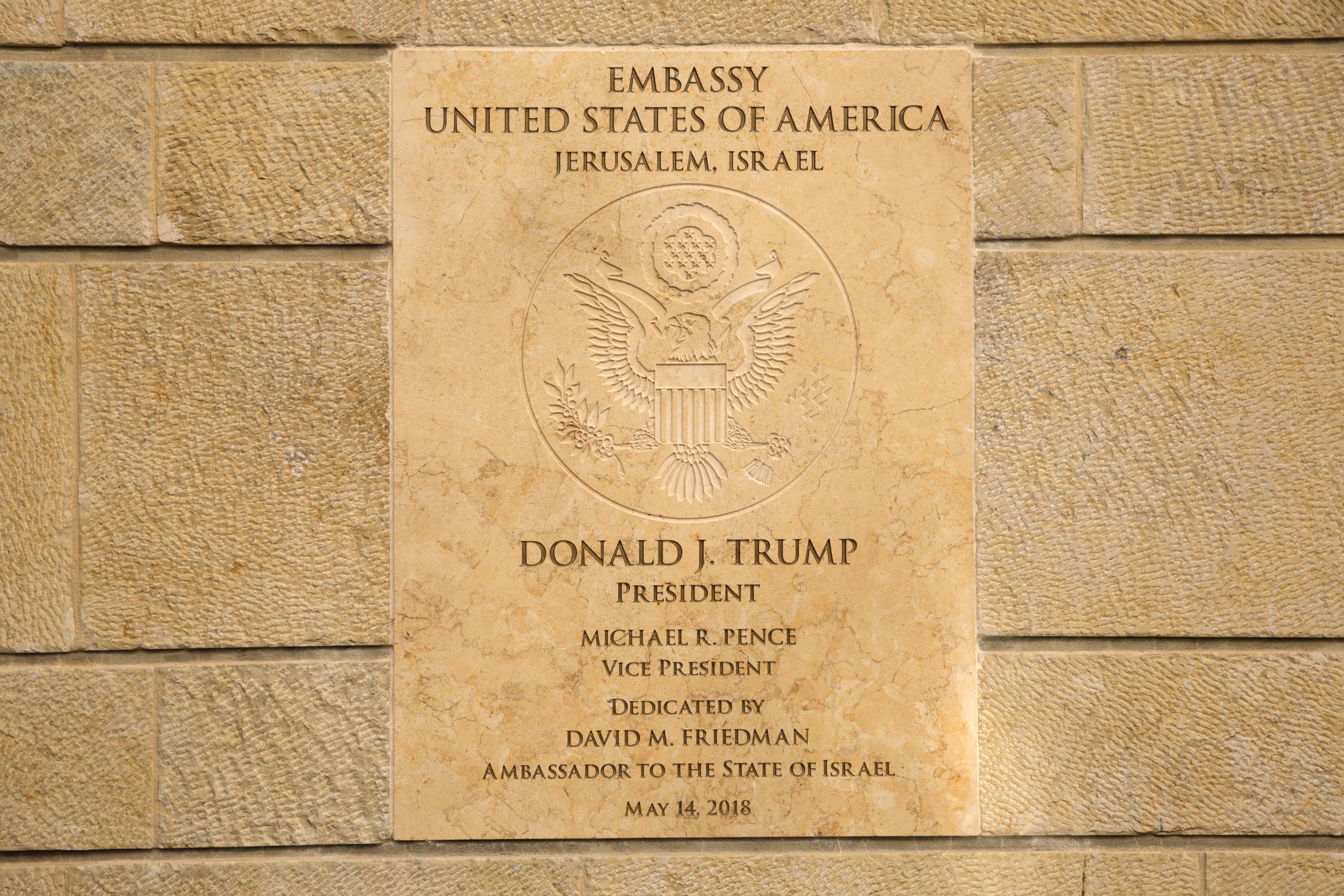 A plaque commemorates the opening of the new US embassy in Jerusalem, Monday, May 14, 2018. Amid deadly clashes along the Israeli-Palestinian border, President Donald Trump's top aides and supporters on Monday celebrated the opening of the new U.S. Embassy in Jerusalem as a campaign promised fulfilled. (AP Photo/Sebastian Scheiner)