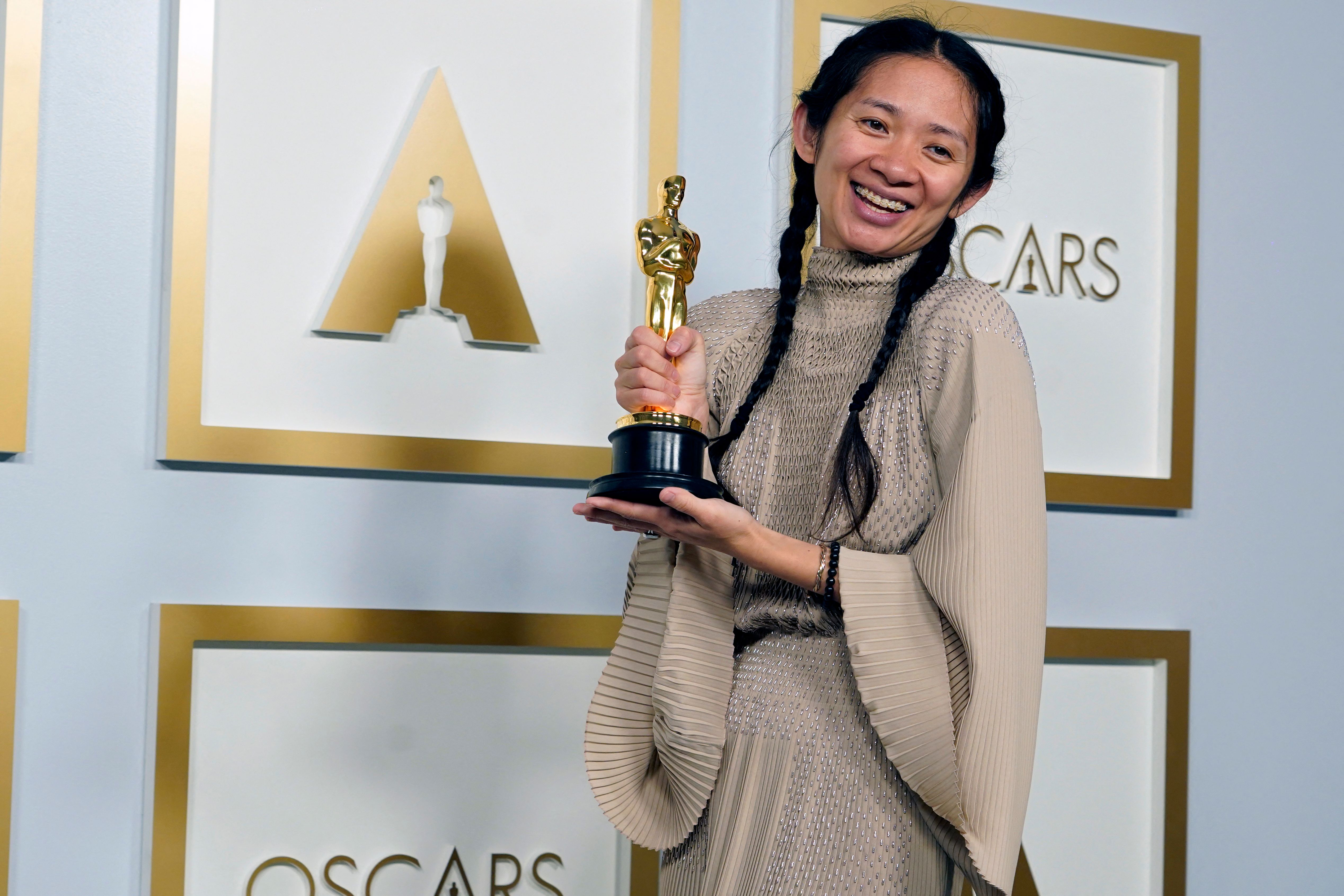 Chinese Director/Producer Chloe Zhao, winner of the award for Picture for "Nomadland," poses in the press room at the Oscars on April 25, 2021, at Union Station in Los Angeles. (Photo by Chris Pizzello / POOL / AFP)