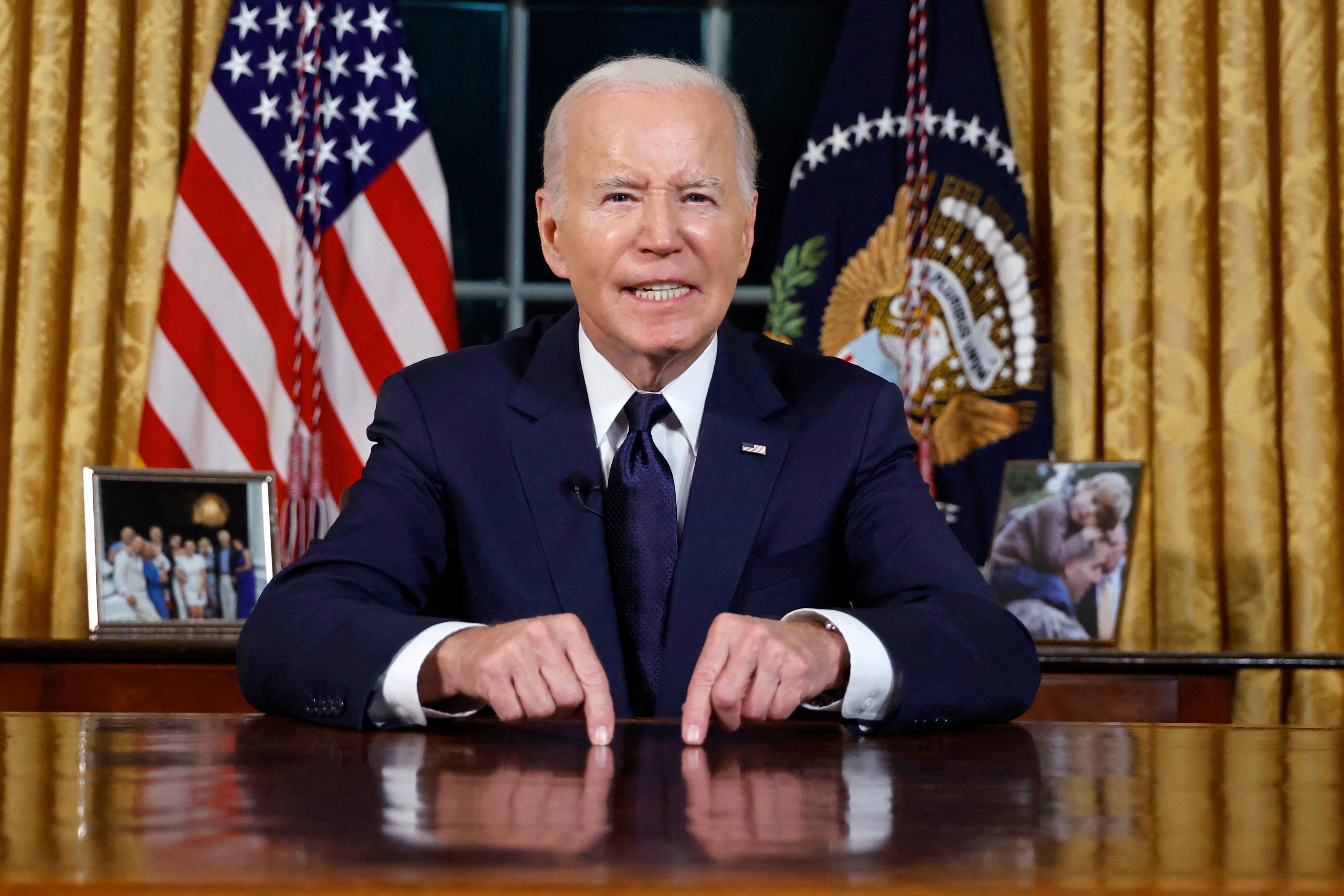 TOPSHOT - US President Joe Biden addresses the nation on the conflict between Israel and Gaza and the Russian invasion of Ukraine from the Oval Office of the White House in Washington, DC, on October 19, 2023. President Joe Biden will deliver a rare Oval Office speech October 19, 2023 urging Americans to back military aid for Israel and Ukraine at what he calls a perilous moment for democracy around the globe. (Photo by JONATHAN ERNST / POOL / AFP)