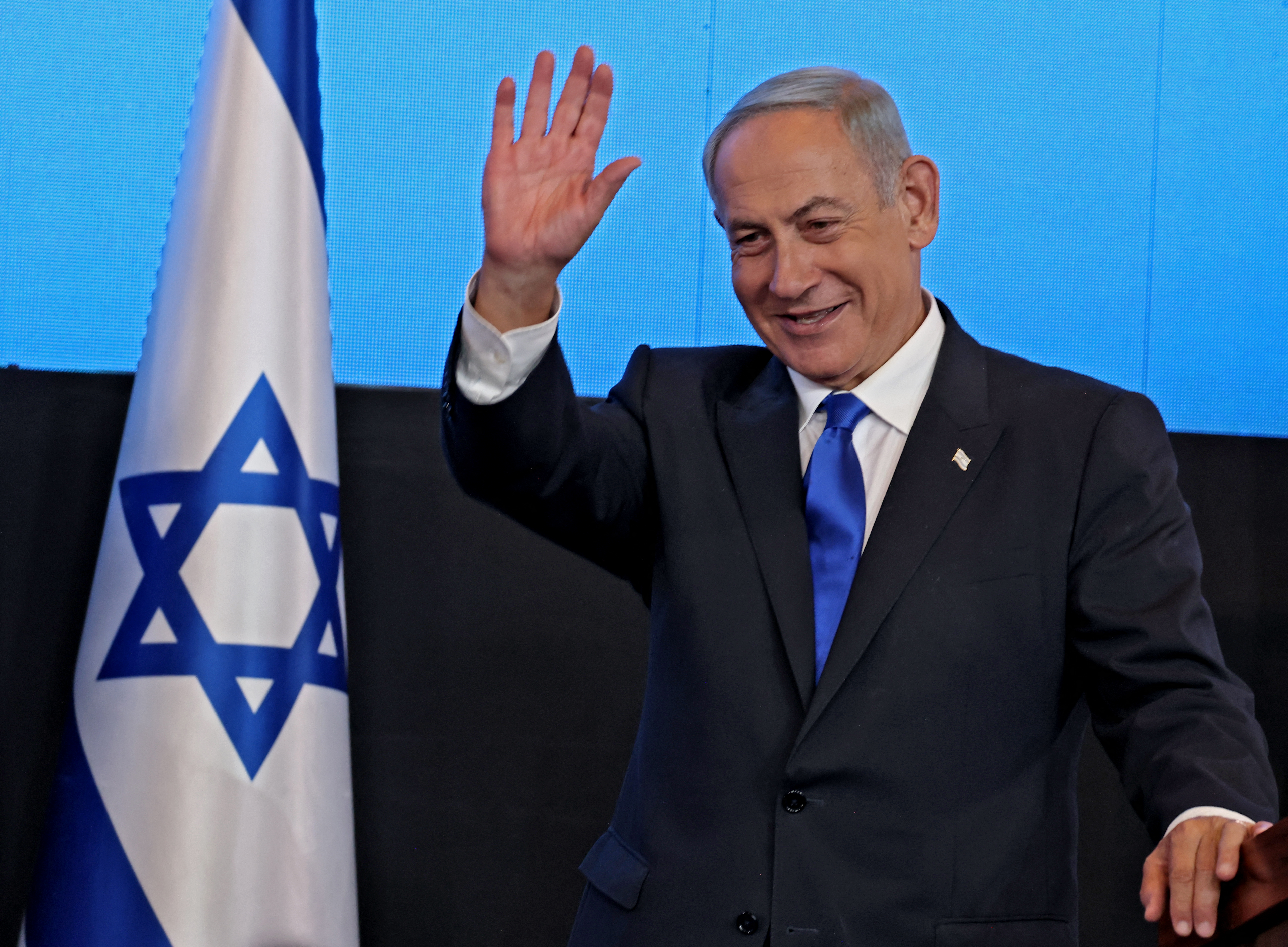 Israel's ex-premier and leader of the Likud party Benjamin Netanyahu addresses supporters at campaign headquarters in Jerusalem early on November 2, 2022, after the end of voting for national elections. - Netanyahu inched towards reclaiming power after projected election results showed a majority government was within reach for the veteran right-winger, but the outlook could shift as ballots are counted. (Photo by Menahem KAHANA / AFP)