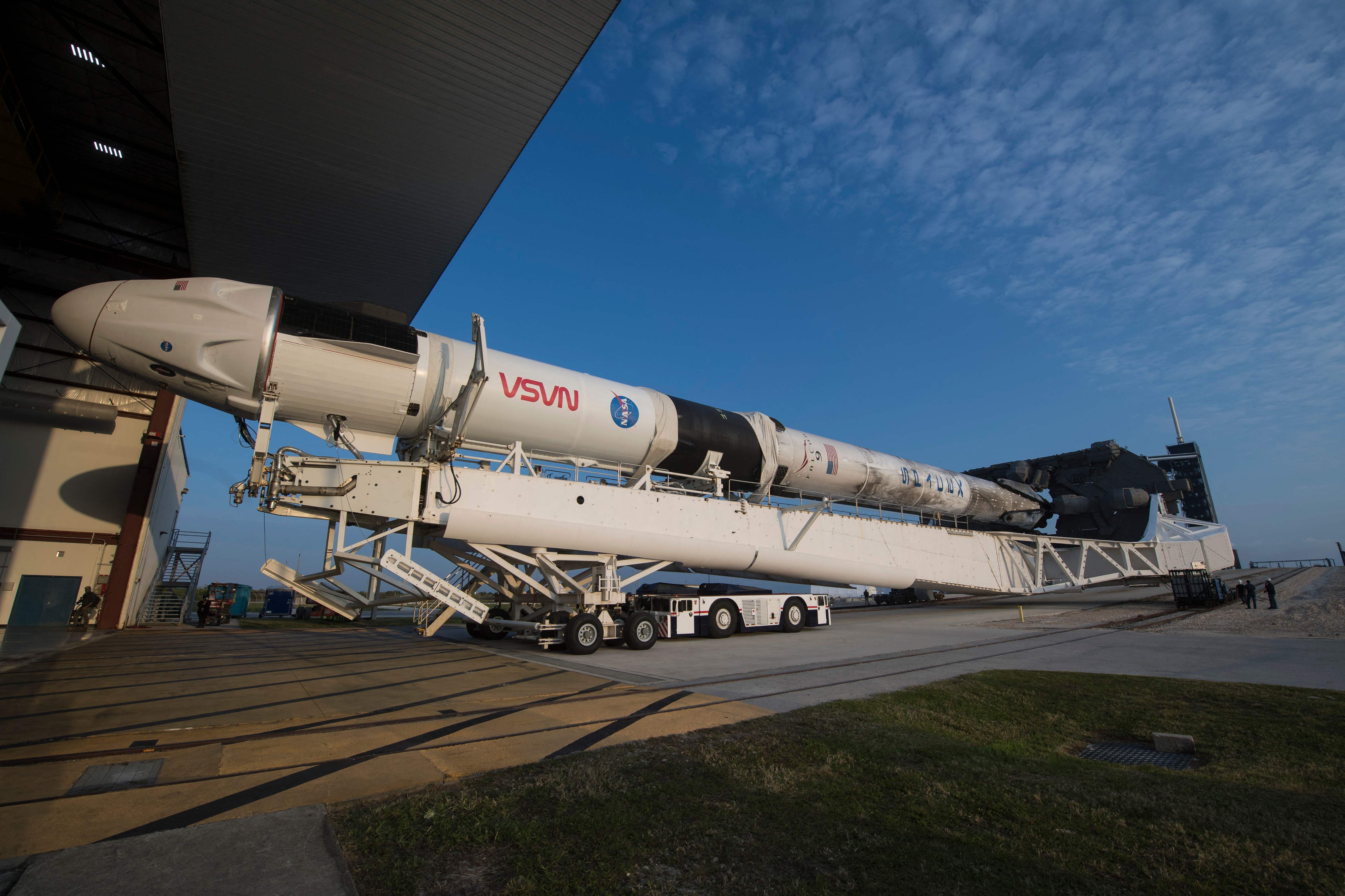 In this image released by NASA, a SpaceX Falcon 9 rocket with the company's Crew Dragon spacecraft onboard is rolled out of the horizontal integration facility at Launch Complex 39A during preparations for the Crew-2 mission, on April 16, 2021, at Kennedy Space Center in Florida. - NASA�s SpaceX Crew-2 mission is the second crew rotation mission of the SpaceX Crew Dragon spacecraft and Falcon 9 rocket to the International Space Station as part of the agency�s Commercial Crew Program. NASA astronauts Shane Kimbrough and Megan McArthur, ESA (European Space Agency) astronaut Thomas Pesquet, and Japan Aerospace Exploration Agency (JAXA) astronaut Akihiko Hoshide are scheduled to launch on April 22. (Photo by Aubrey GEMIGNANI / NASA / AFP) / RESTRICTED TO EDITORIAL USE - MANDATORY CREDIT "AFP PHOTO / NASA / Aubrey Gemignani" - NO MARKETING - NO ADVERTISING CAMPAIGNS - DISTRIBUTED AS A SERVICE TO CLIENTS