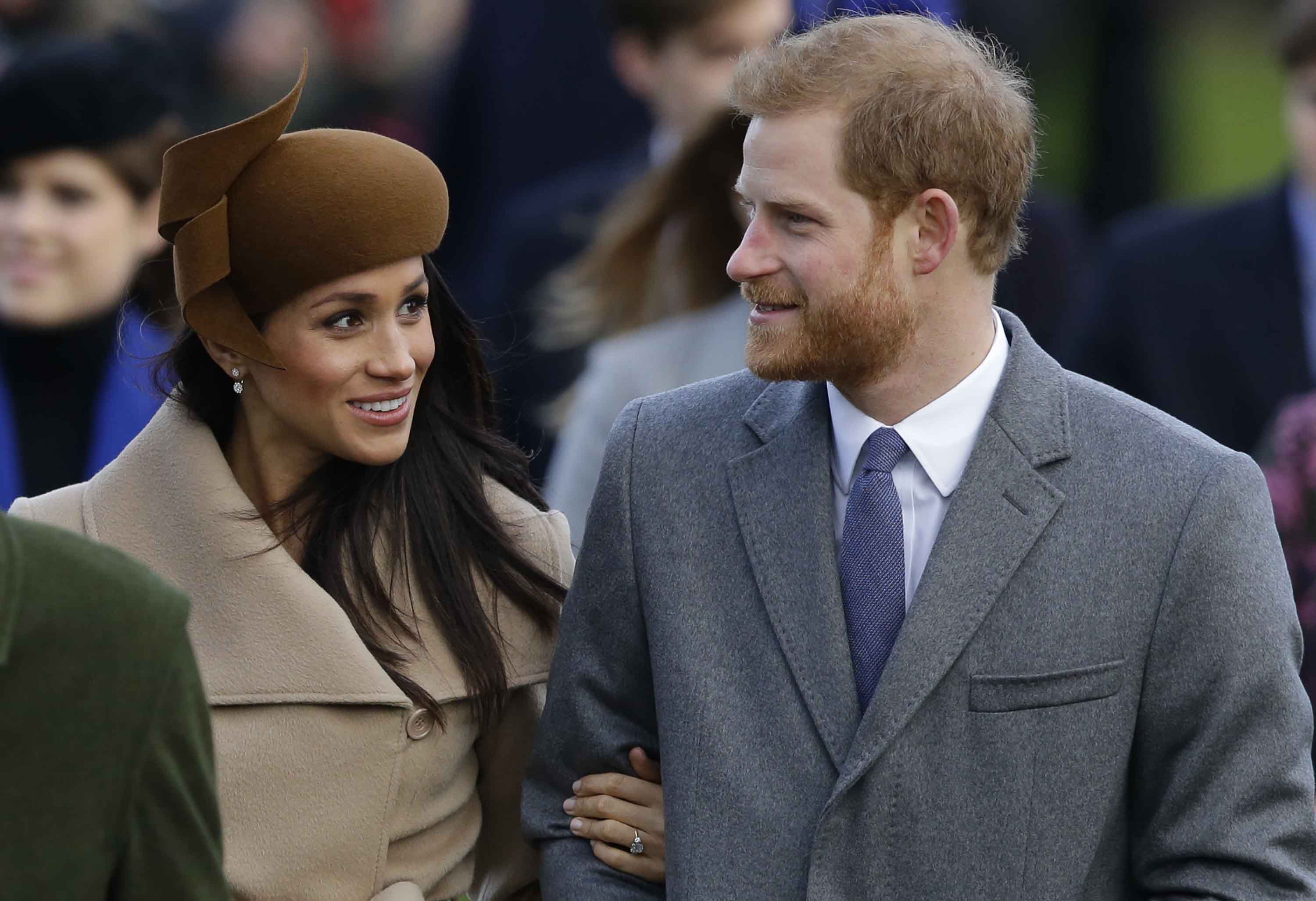 Prince Harry and his fiancee Meghan Markle arrive to attend the traditional Christmas Day service, at St. Mary Magdalene Church in Sandringham, England, Monday, Dec. 25, 2017. (AP Photo/Alastair Grant)