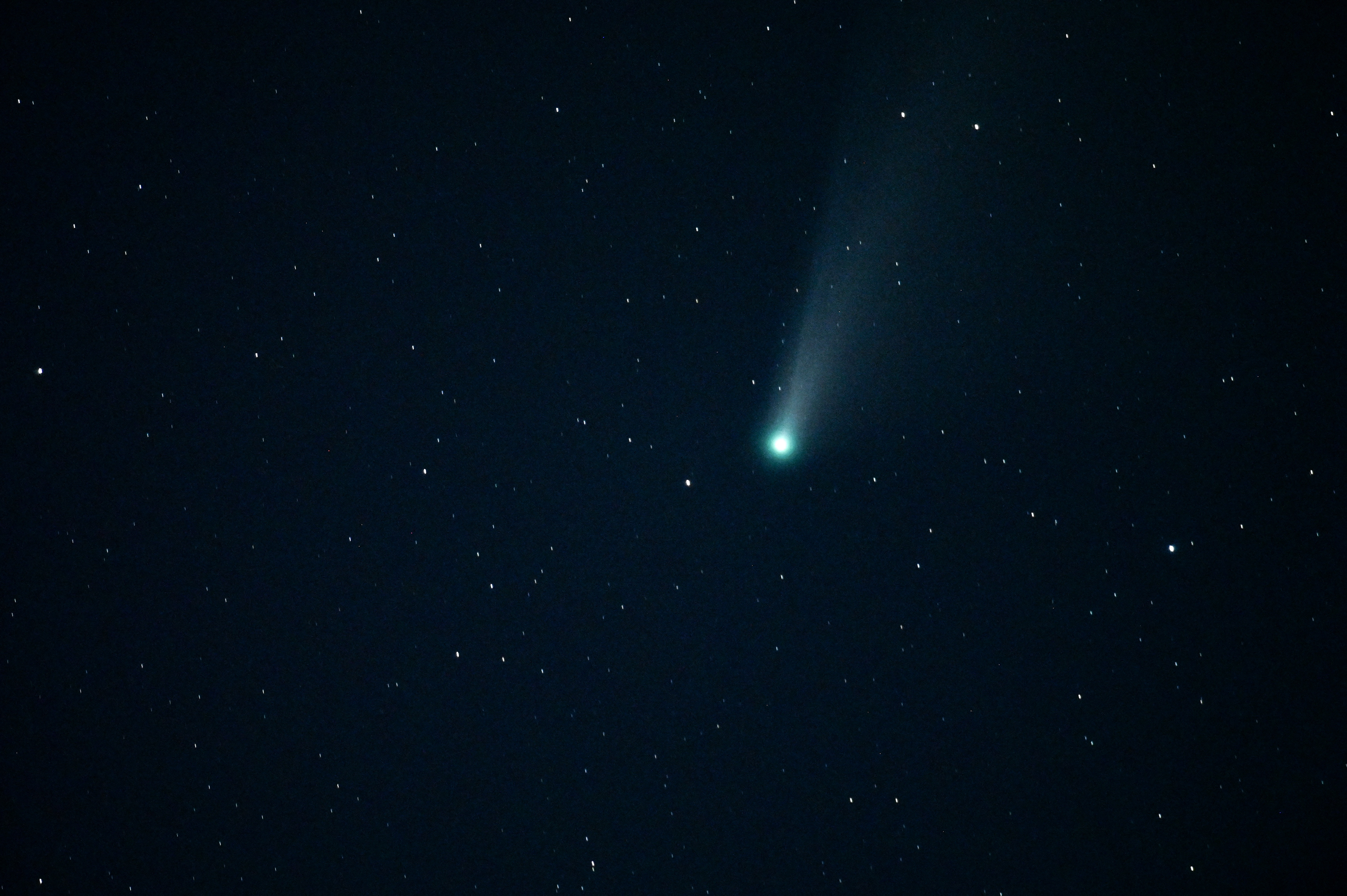 This long-exposure photograph taken on July 24, 2020 shows a view of the Comet NEOWISE (C/2020 F3) in the sky over Shwebo, Sagaing region in Myanmar. The Comet C/2020 F3 was discovered on March 27, 2020, by NEOWISE, the Near Earth Object Wide-field Infrared Survey Explorer, which is a space telescope launched by NASA in 2009. (Photo by Ye Aung Thu / AFP)