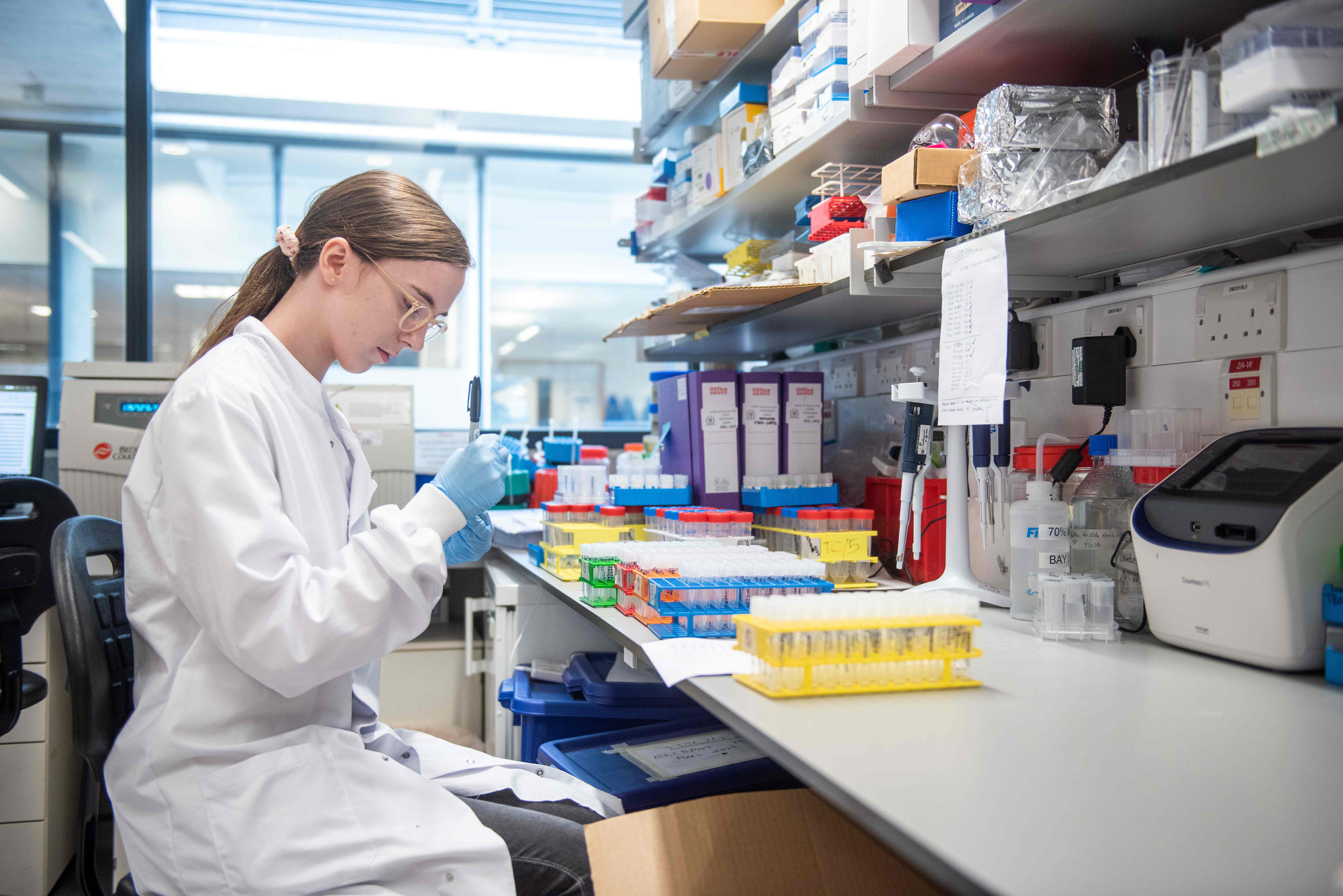 (FILES) An undated handout picture released by the University of Oxford on November 23, 2020 shows a technician working on the University's COVID-19 candidate vaccine, known as AZD1222, co-invented by the University of Oxford and Vaccitech in partnership with pharmaceutical giant AstraZeneca. - Britain on December 30, 2020 became the first country in the world to approve the coronavirus vaccine developed by drug firm AstraZeneca and Oxford University, with a mass rollout planned from January 4, 2021. (Photo by John Cairns / University of Oxford / AFP) / RESTRICTED TO EDITORIAL USE - MANDATORY CREDIT "AFP PHOTO / UNIVERSITY OF OXFORD / John Cairns " - NO MARKETING - NO ADVERTISING CAMPAIGNS - RESTRICTED TO ILLUSTRATING STORIES RELATED TO THE PARTICULAR VACCINE, EVENTS AND FACTS MENTIONED IN THE CAPTION - DISTRIBUTED AS A SERVICE TO CLIENTS /