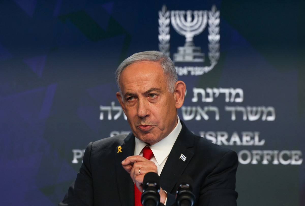 Israeli Prime Minister Benjamin Netanyahu gives a press conference in Jerusalem on May 21, 2025. Netanyahu said on May 21 that he was ready for a "temporary ceasefire" to guarantee the return of hostages held in Gaza, of whom 20 are "certainly" alive. (Photo by Ronen Zvulun / POOL / AFP)