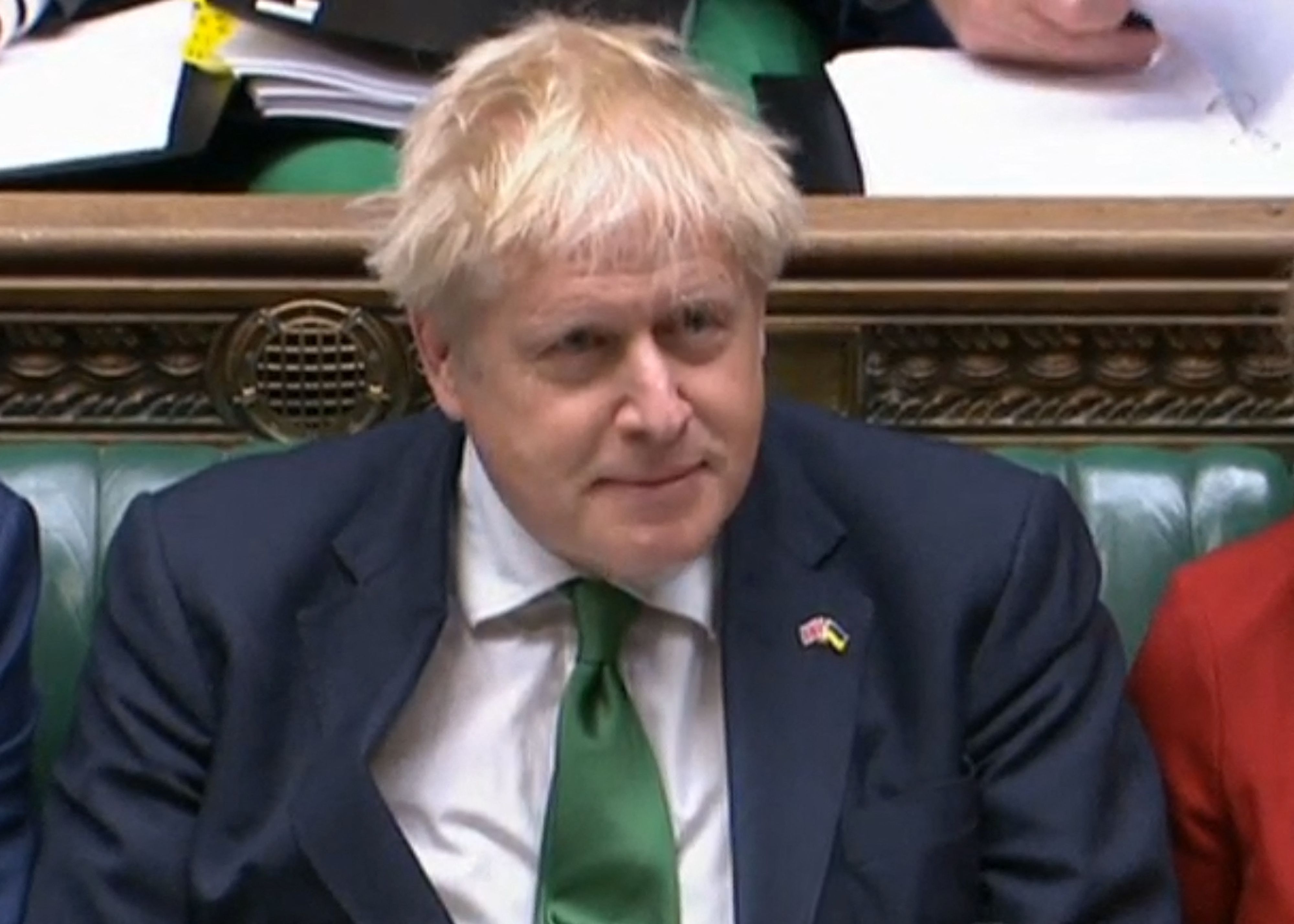 A video grab from footage broadcast by the UK Parliament's Parliamentary Recording Unit (PRU) shows Britain's Prime Minister Boris Johnson during the weekly session of Prime Minister's Questions (PMQs) at the House of Commons, in London, on June 8, 2022. - UK Prime Minister Boris Johnson makes his first appearance in parliament on Wednesday since surviving a no-confidence vote of his own Conservative MPs that has undermined his leadership. The beleaguered leader's backers are likely to stage a noisy show of support when he steps up for his weekly Prime Minister's Questions. (Photo by various sources / AFP) / RESTRICTED TO EDITORIAL USE - MANDATORY CREDIT "AFP PHOTO / PRU " - NO MARKETING - NO ADVERTISING CAMPAIGNS - DISTRIBUTED AS A SERVICE TO CLIENTS