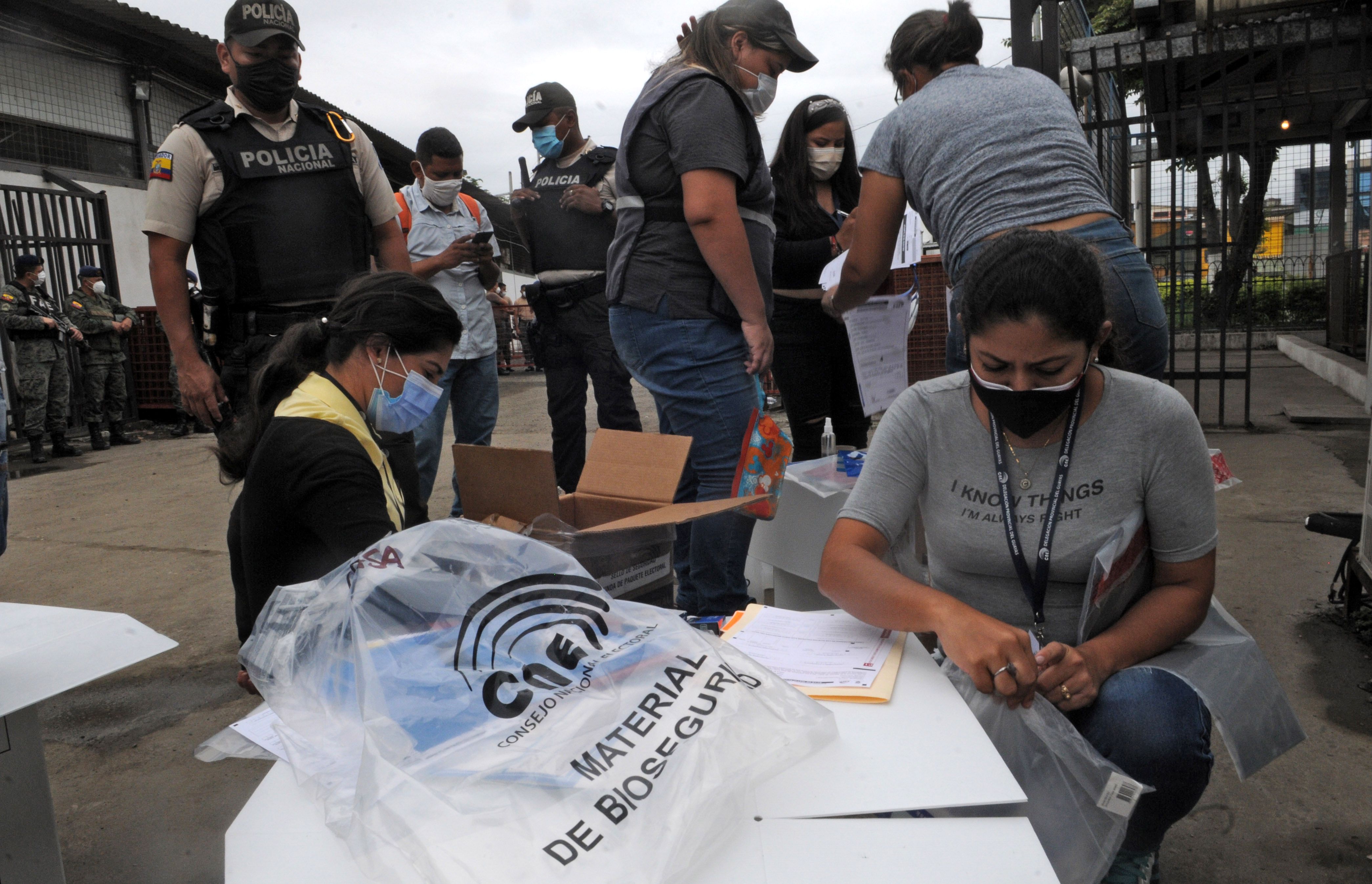 Employees prepare electoral material for Sunday's election outside the National Electoral Council's headquarters in Guayaquil, Ecuador on February 5, 2021. - Presidential and legislative elections take place in Ecuador on February 7, 2021. (Photo by JOSE SANCHEZ LINDAO / AFP)