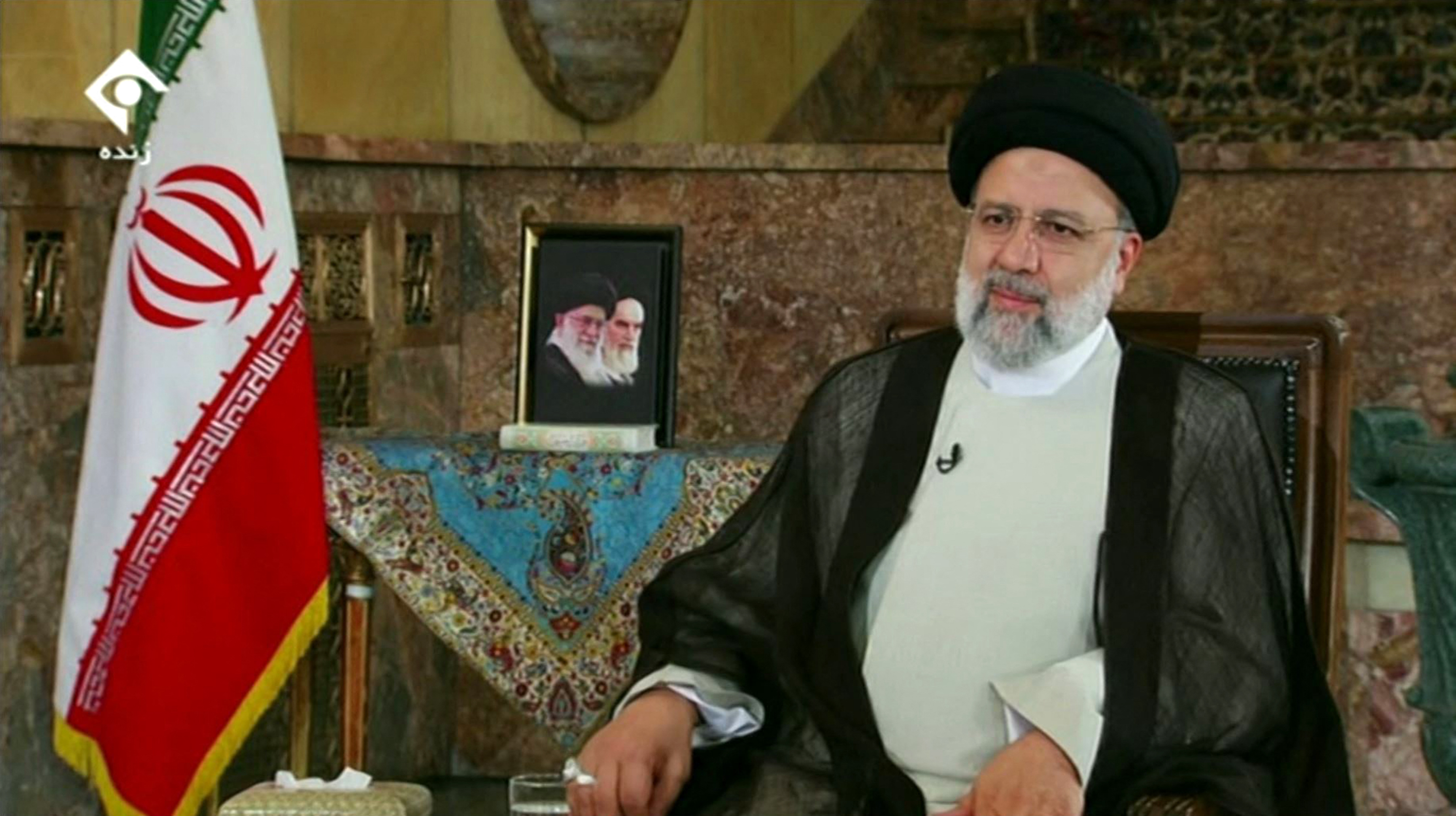 An image grab from a video released by state-run Iran Press news agency shows Iran's President Ebrahim Raisi speaking during a televised interview in the capital Tehran on September 28, 2022. - Raisi condemned the "rioters" behind the wave of women-led protests sparked by the death of Mahsa Amini while in the custody of the Islamic republic's morality police. Raisi said the nation had felt "grief and sorrow" over her death, and that forensics and judiciary experts would soon present a final report, but also warned that "protests are different to riots". (Photo by IRAN PRESS / AFP) / RESTRICTED TO EDITORIAL USE - MANDATORY CREDIT - AFP PHOTO / HO / IRAN PRESS" NO MARKETING NO ADVERTISING CAMPAIGNS - DISTRIBUTED AS A SERVICE TO CLIENTS FROM ALTERNATIVE SOURCES, AFP IS NOT RESPONSIBLE FOR ANY DIGITAL ALTERATIONS TO THE PICTURE'S EDITORIAL CONTENT, DATE AND LOCATION WHICH CANNOT BE INDEPENDENTLY VERIFIED - NO RESALE - NO ACCESS ISRAEL MEDIA/PERSIAN LANGUAGE TV STATIONS/ OUTSIDE IRAN/ STRICTLY NO ACCESS BBC PERSIAN/ VOA PERSIAN/ MANOTO-1 TV/ IRAN INTERNATIONAL/RADIO FARDA /