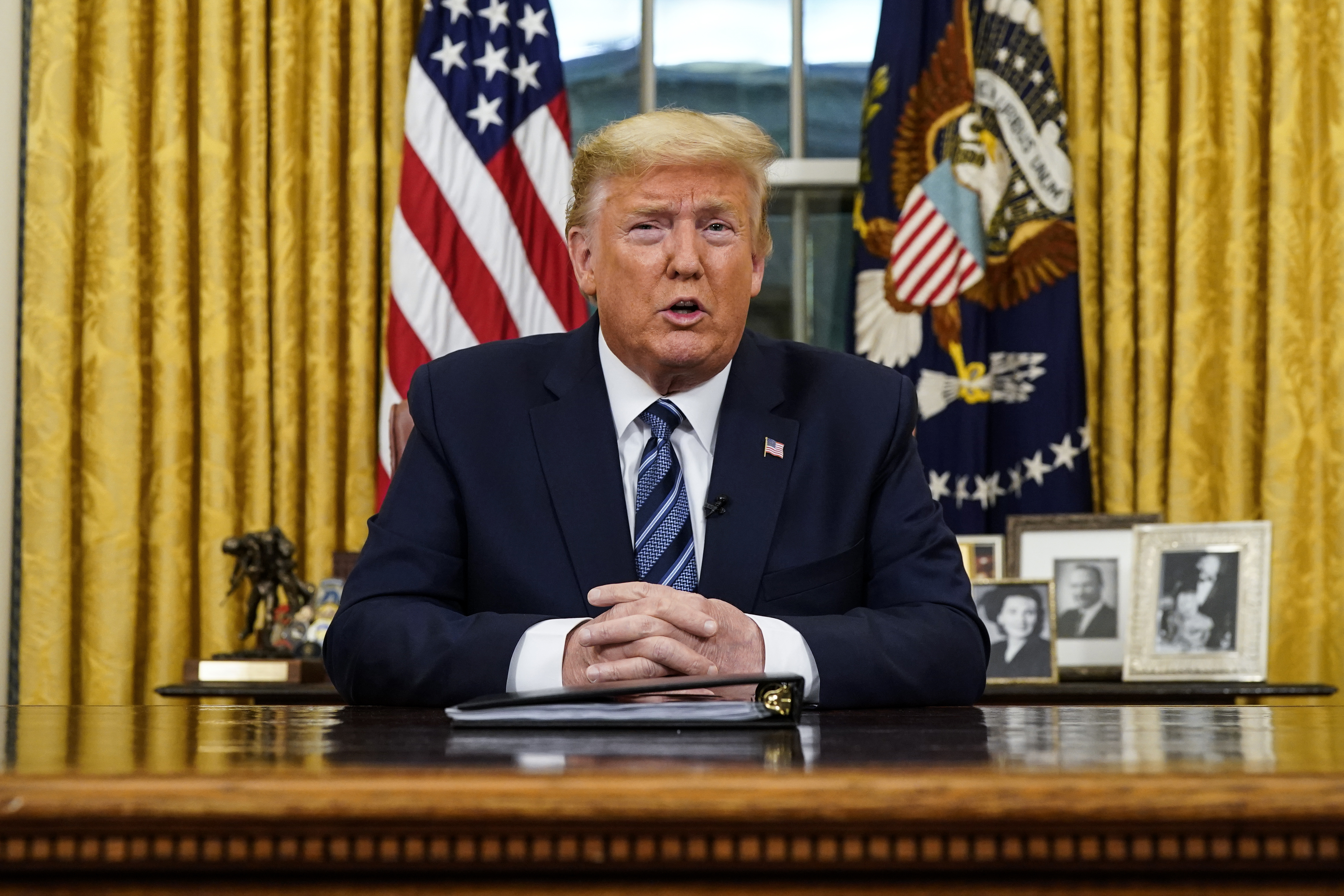 President Donald Trump speaks in an address to the nation from the Oval Office at the White House about the coronavirus Wednesday, March, 11, 2020, in Washington. (Doug Mills/The New York Times via AP, Pool)